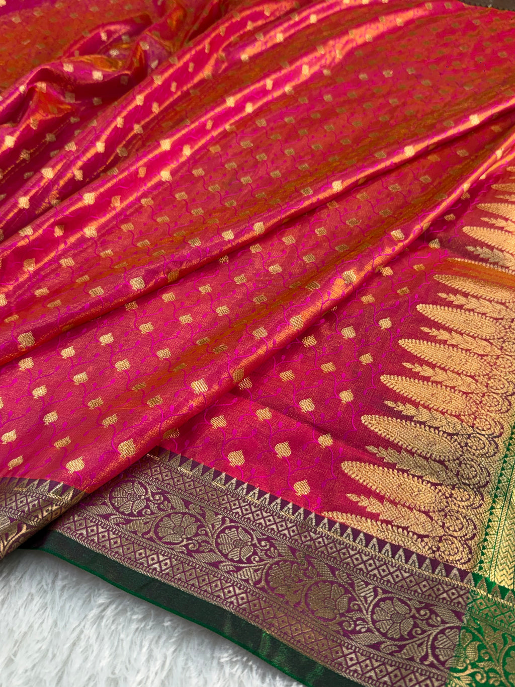 Banarasi satin silk saree in Rani color with tanchoi design all over the body