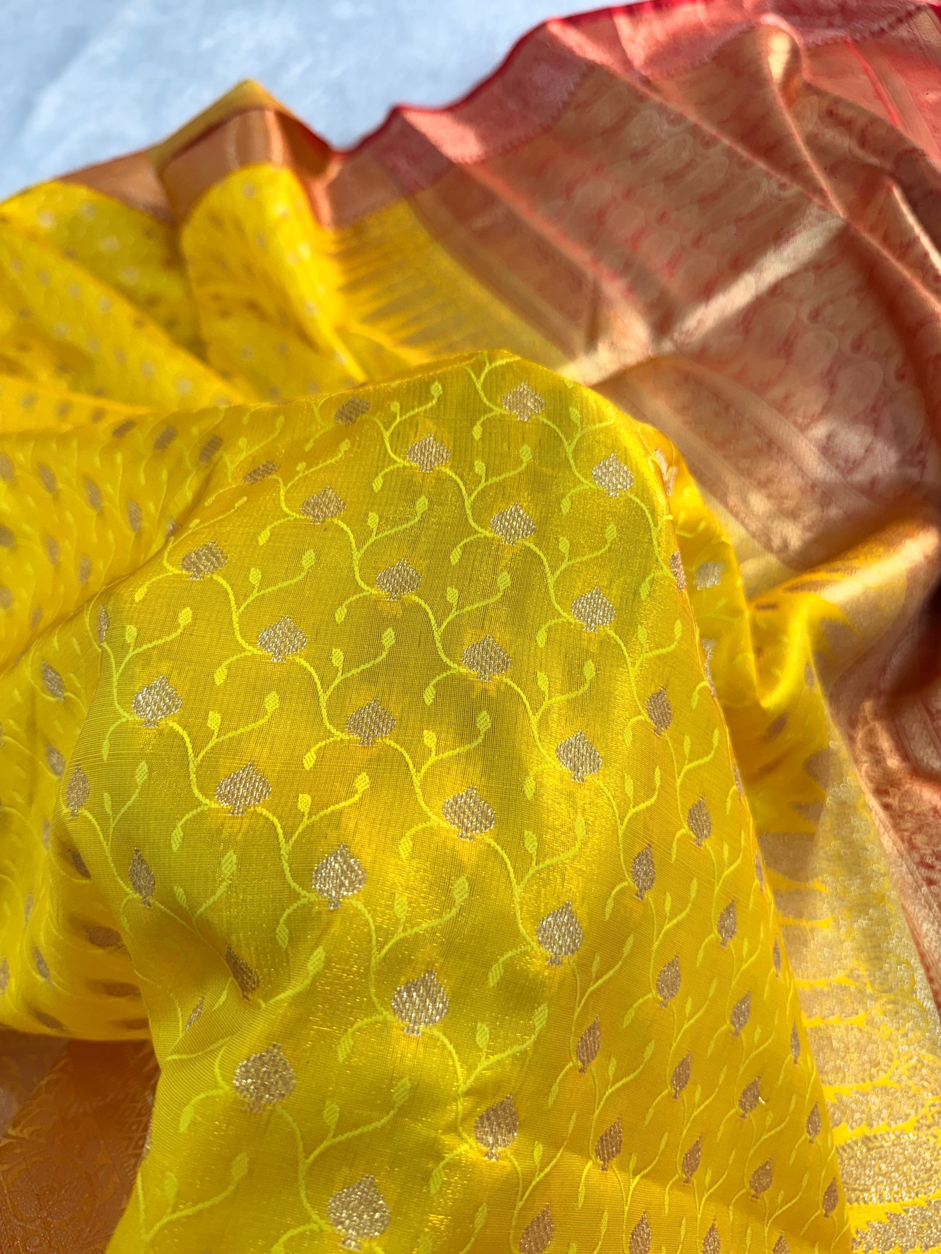 Banarasi satin silk saree in yellow color with tanchoi design all over the body