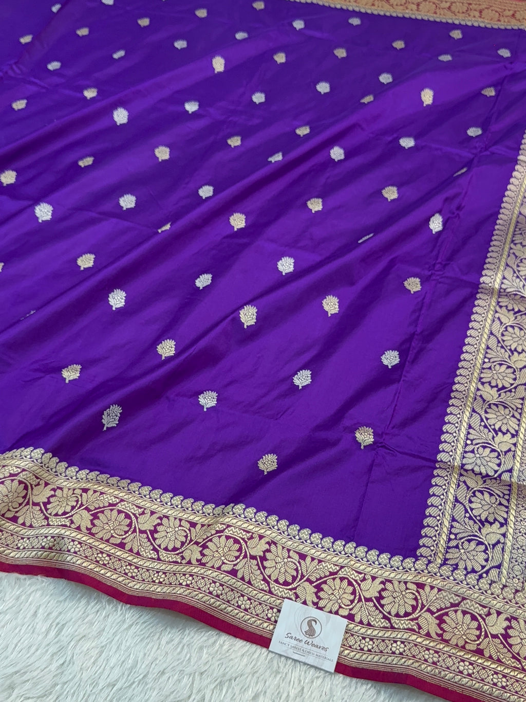 Handwoven pure katan silk saree with interlock weaving motifs in intricate silver and gold zari with Contrast of Deep Violet and Shot Rani Colour