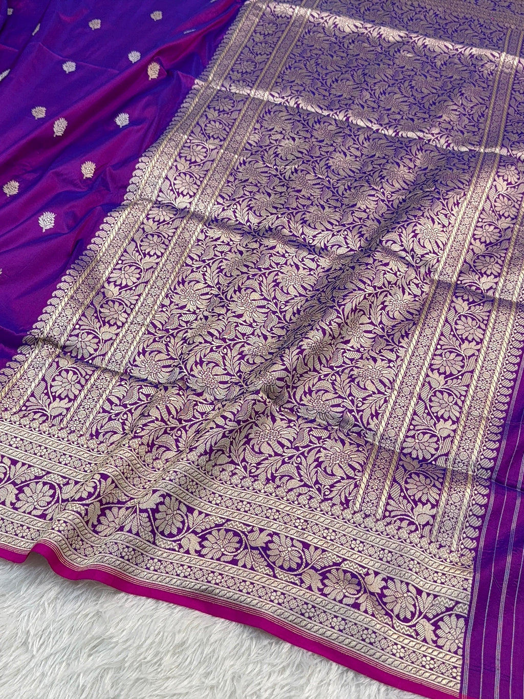 Handwoven pure katan silk saree with interlock weaving motifs in intricate silver and gold zari with Rani Edge in Deep Violet colour