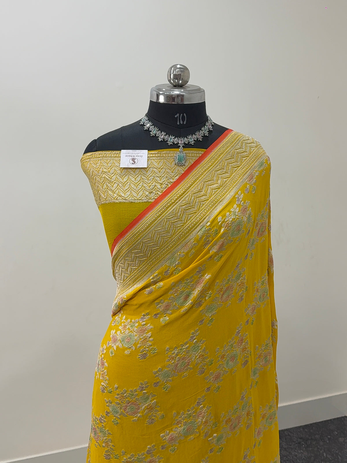 Banarasi Pure Khaddi Chiffon Saree  with Silver Zari Work In Floral Jaal Design with Meenakari by handbrush Yellow Colour with orange edge
