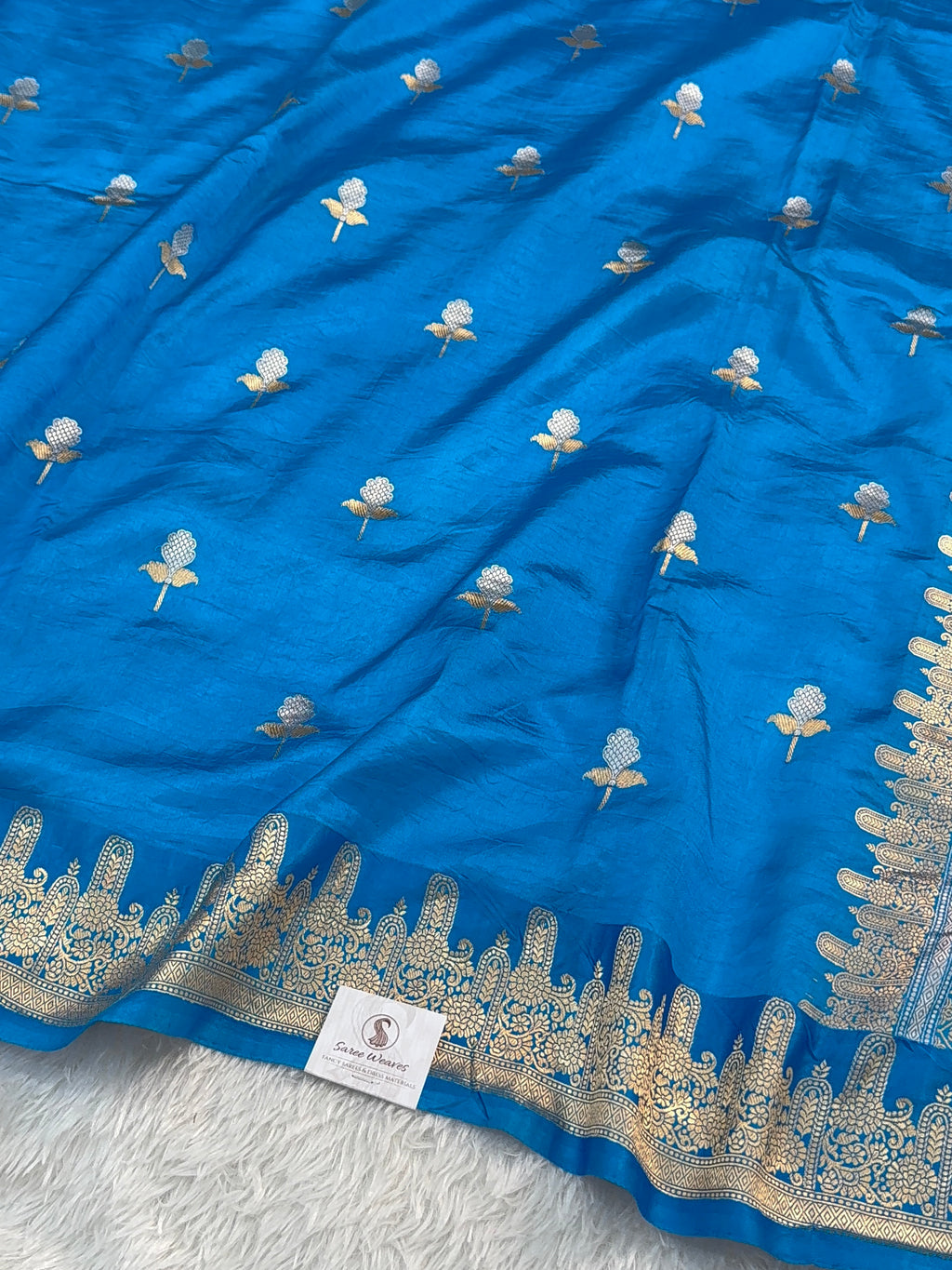 Banarasi Raw Mango Silk Saree in Border and Buta Design in Silver and Gold Zari work in Peacock Blue Color