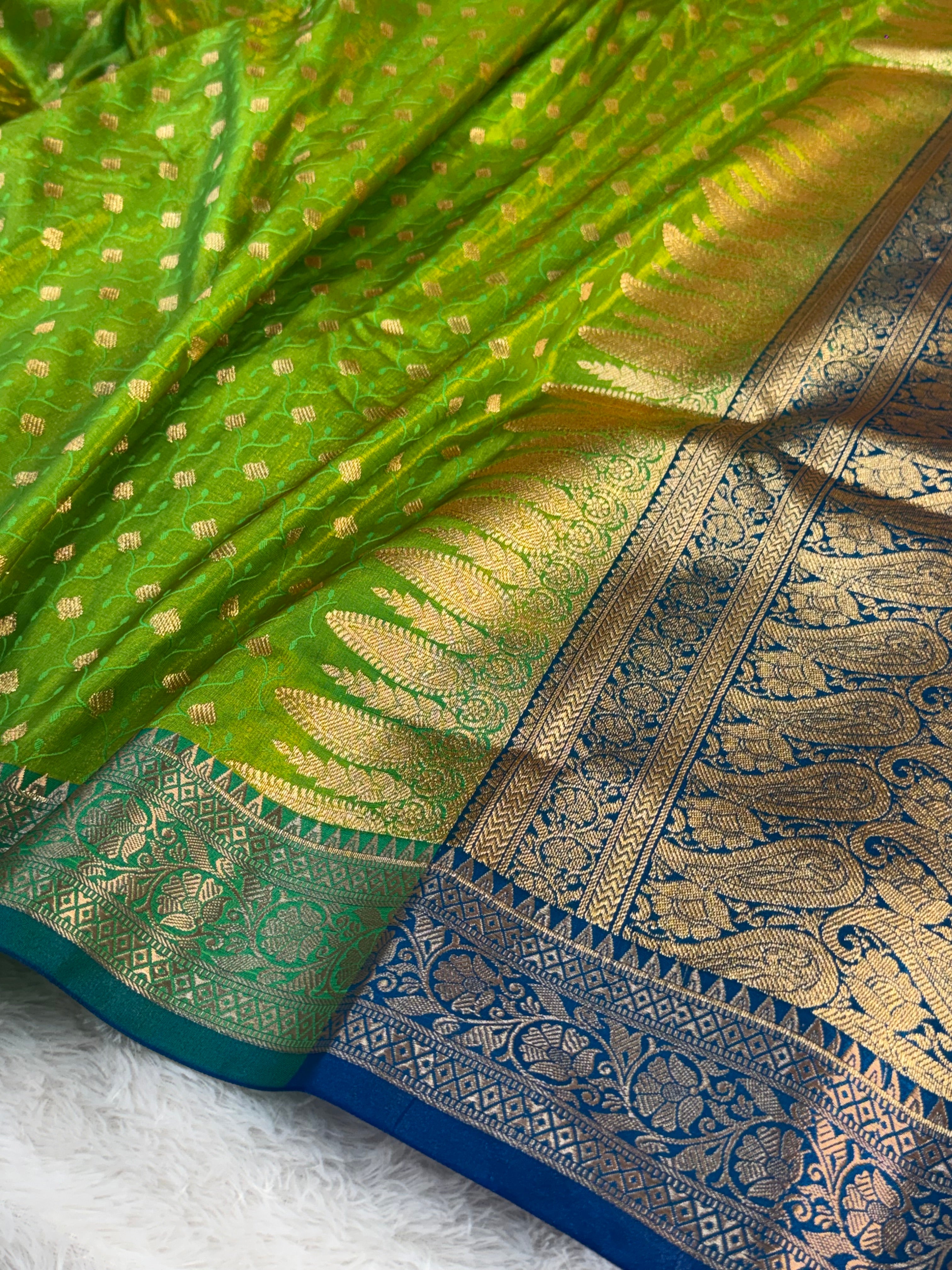 Banarasi satin silk saree in contrast Parrot green color with tanchoi design all over the body