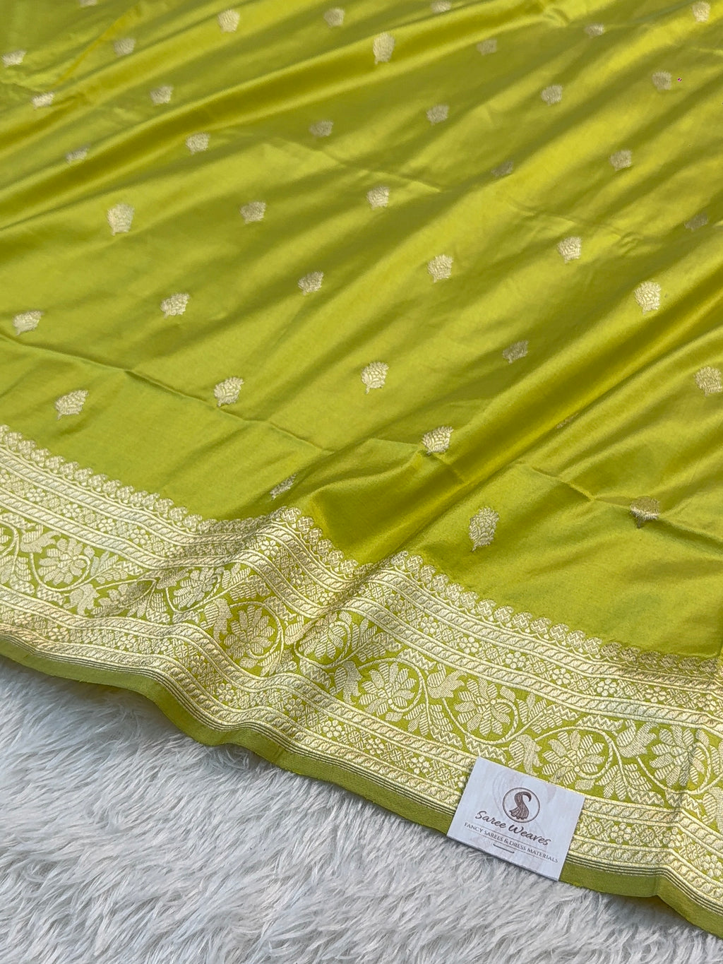 Handwoven pure katan silk saree with interlock weaving motifs with intricate silver zari in Neon Pista colour