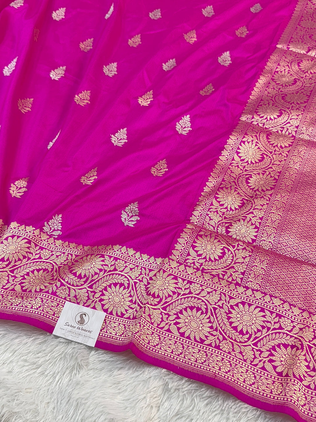 Handwoven pure katan silk saree with interlock weaving motifs with intricate silver and gold zari in a Rani Pink colour