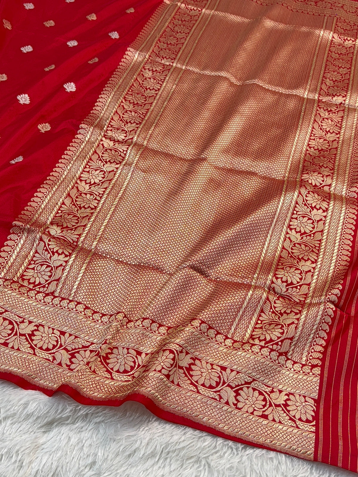 Handwoven pure katan silk saree with interlock weaving motifs with intricate silver and gold zari in red colour