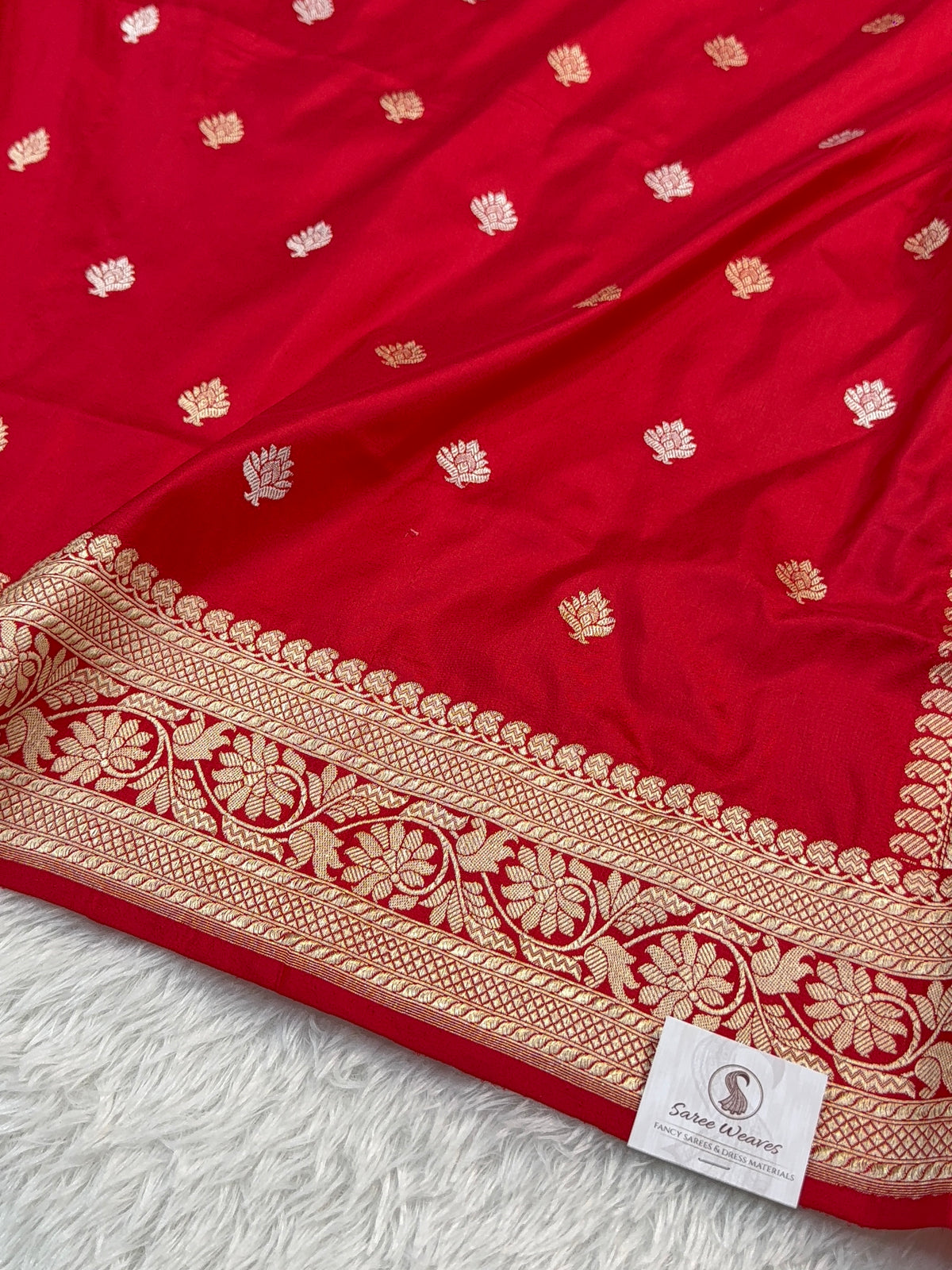 Handwoven pure katan silk saree with interlock weaving motifs with intricate silver and gold zari in red colour
