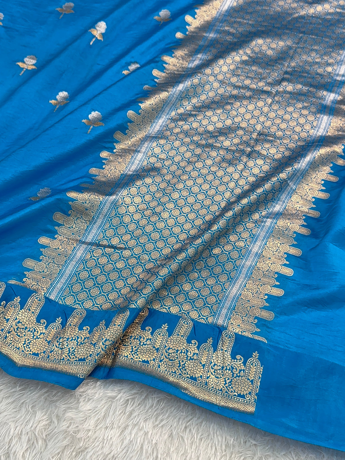 Banarasi Raw Mango Silk Saree in Border and Buta Design in Silver and Gold Zari work in Peacock Blue Color