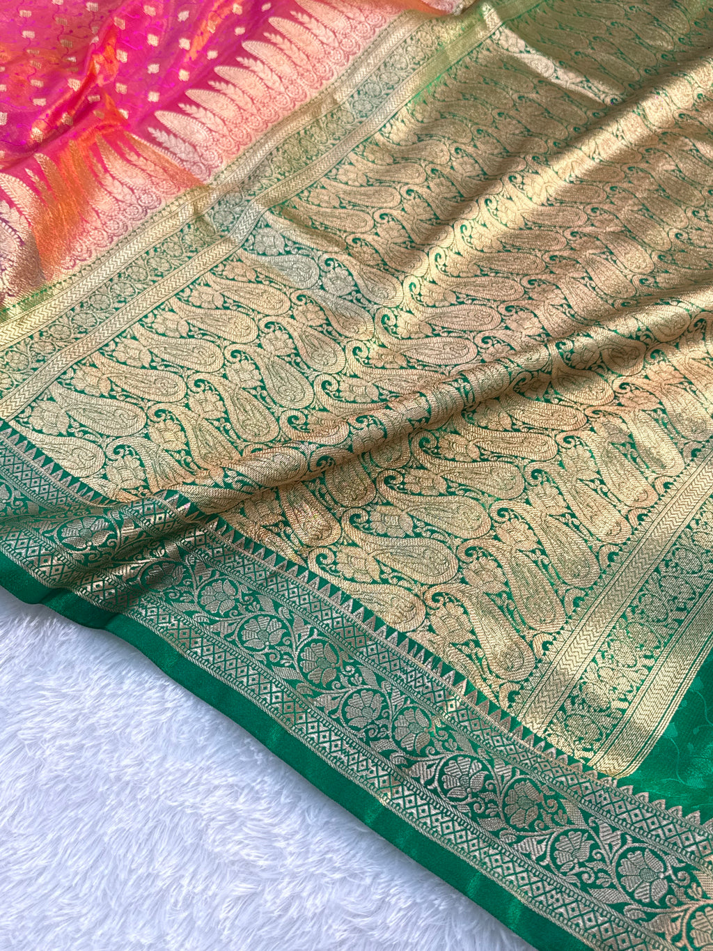 Banarasi satin silk saree in Rani color with tanchoi design all over the body