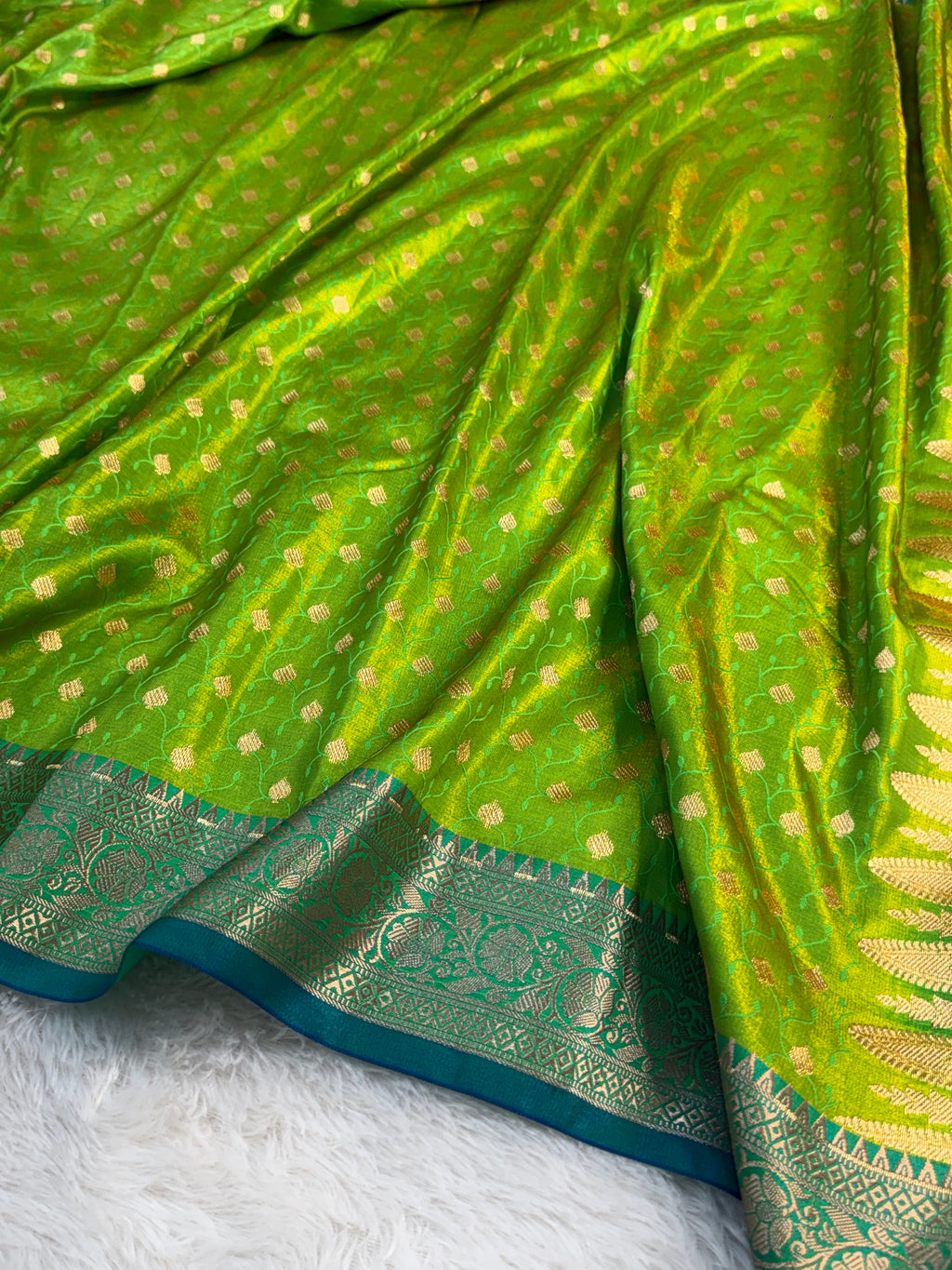 Banarasi satin silk saree in contrast Parrot green color with tanchoi design all over the body