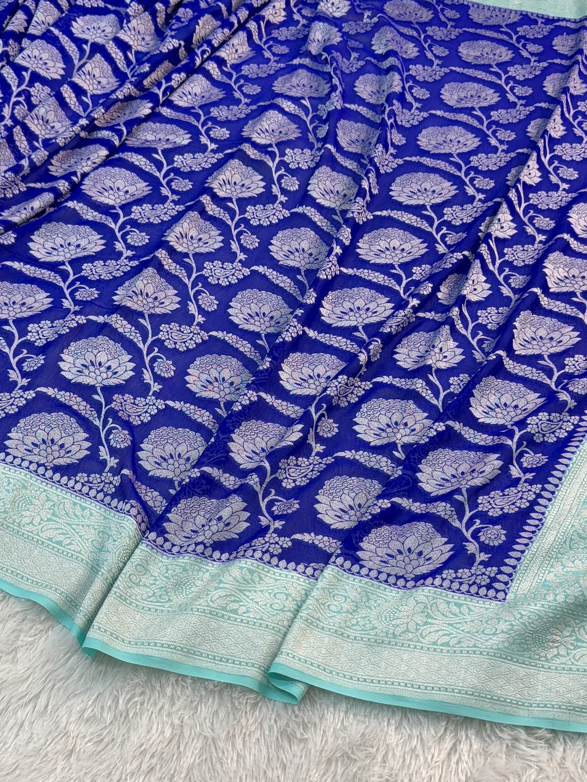 Banarasi Pure Khaddi Chiffon Saree  with Silver Zari Work In Floral Jaal Design in Royal Blue and Light Sea Green Colour Combination