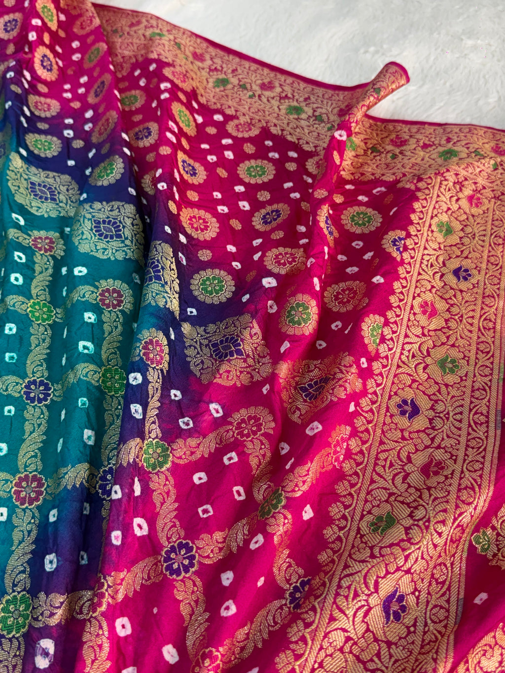 Banarasi Raw Silk Saree with Hand bandej all over in Motifs Design in Rani and Bottle Green Colour