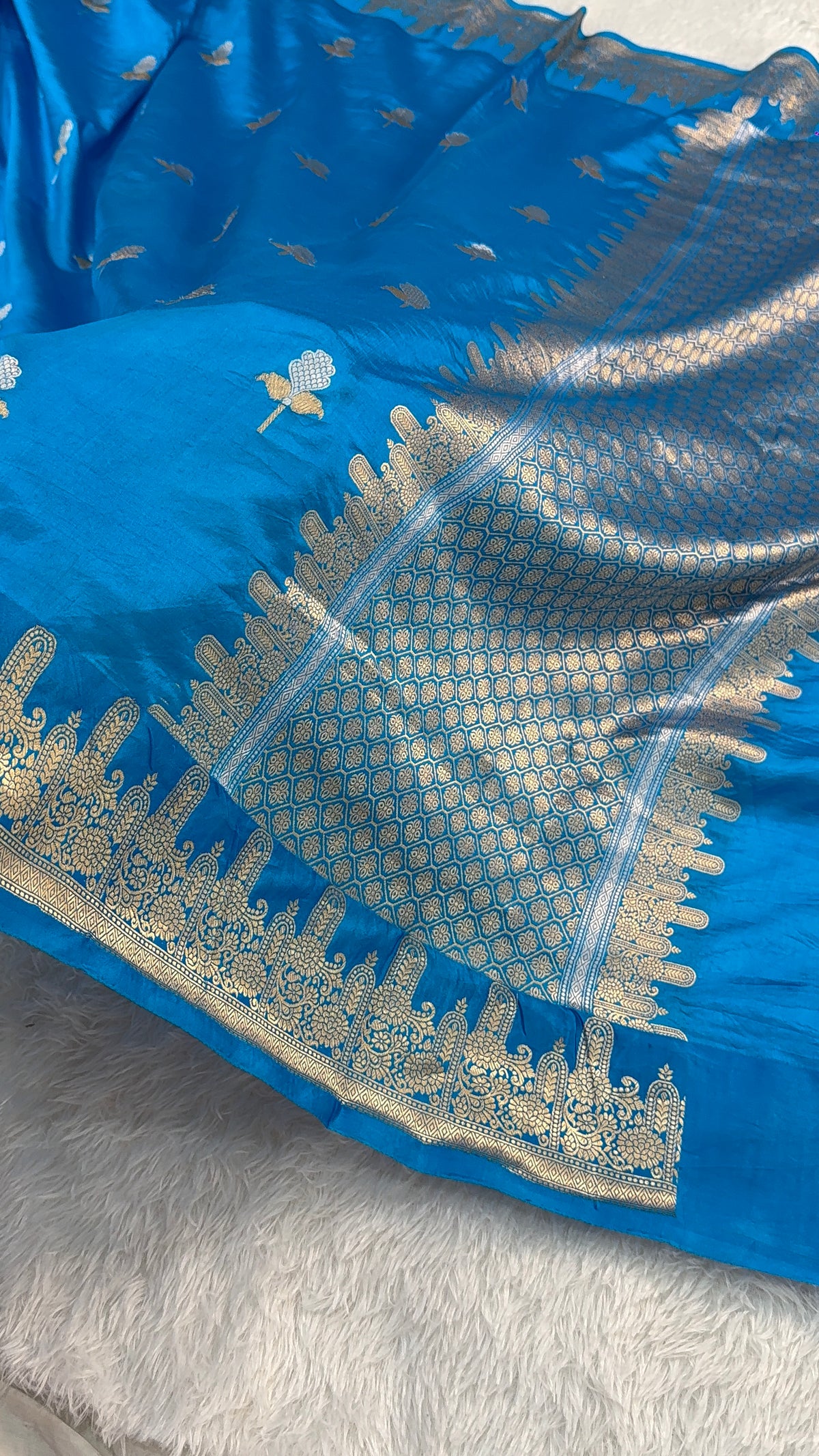 Banarasi Raw Mango Silk Saree in Border and Buta Design in Silver and Gold Zari work in Peacock Blue Color