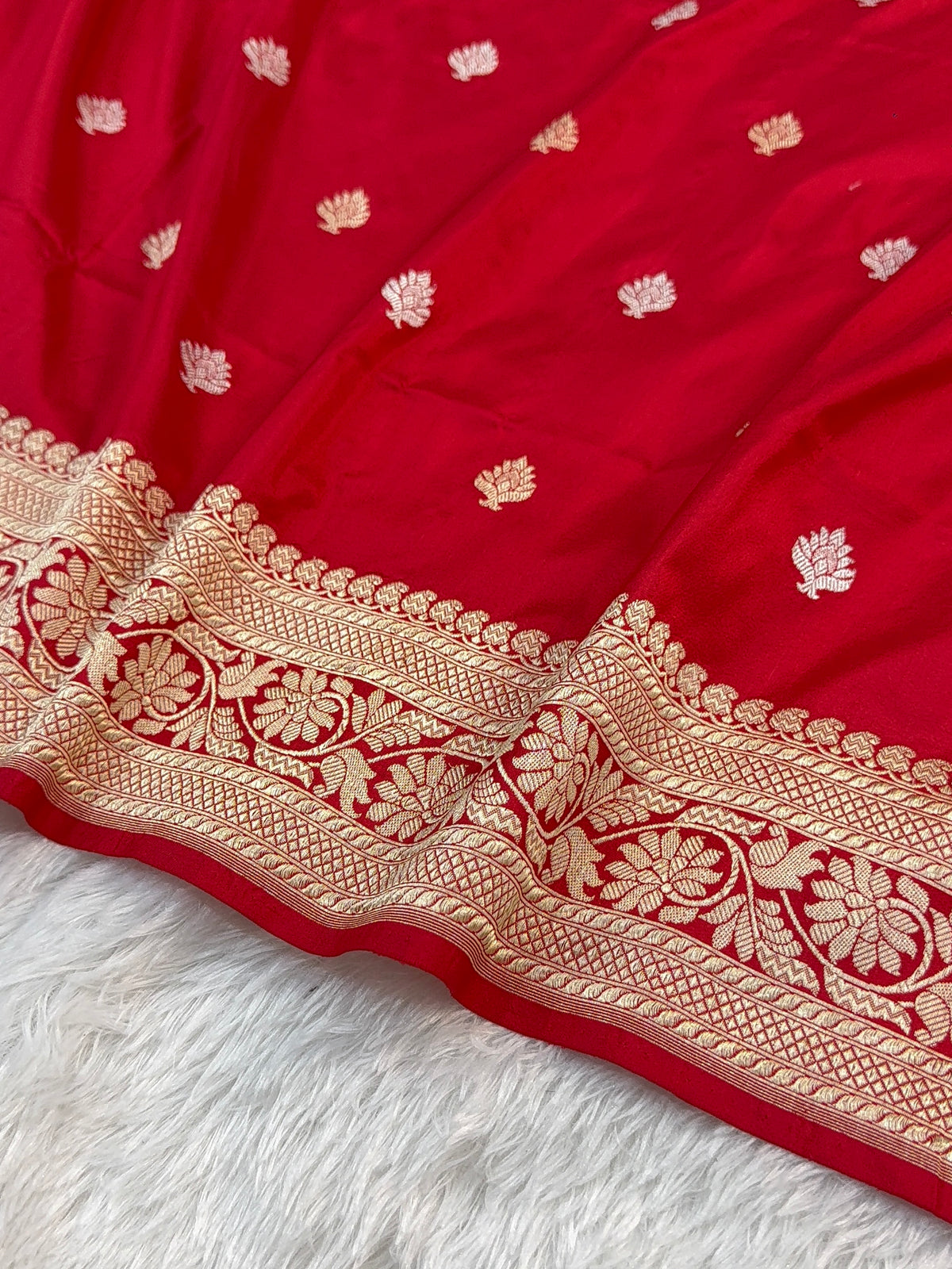 Handwoven pure katan silk saree with interlock weaving motifs with intricate silver and gold zari in red colour