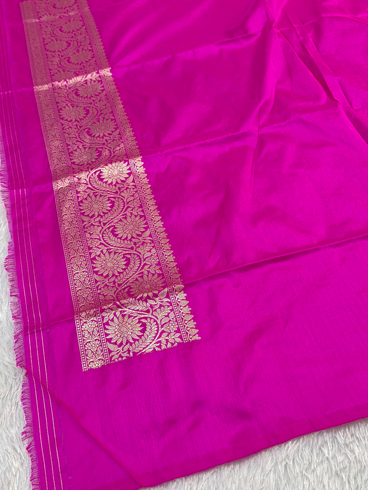 Handwoven pure katan silk saree with interlock weaving motifs with intricate silver and gold zari in a Rani Pink colour