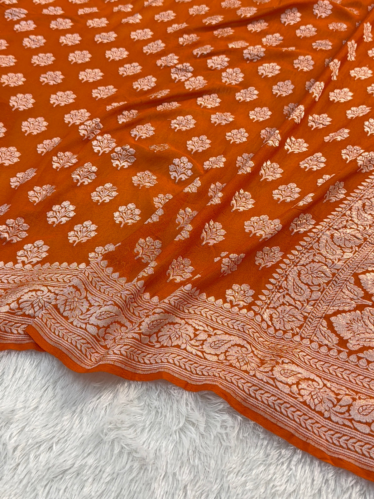 Banarasi Pure Khaddi Chiffon Saree  with Light Gold Zari Work In Floral Motifs Design in Orange Colour