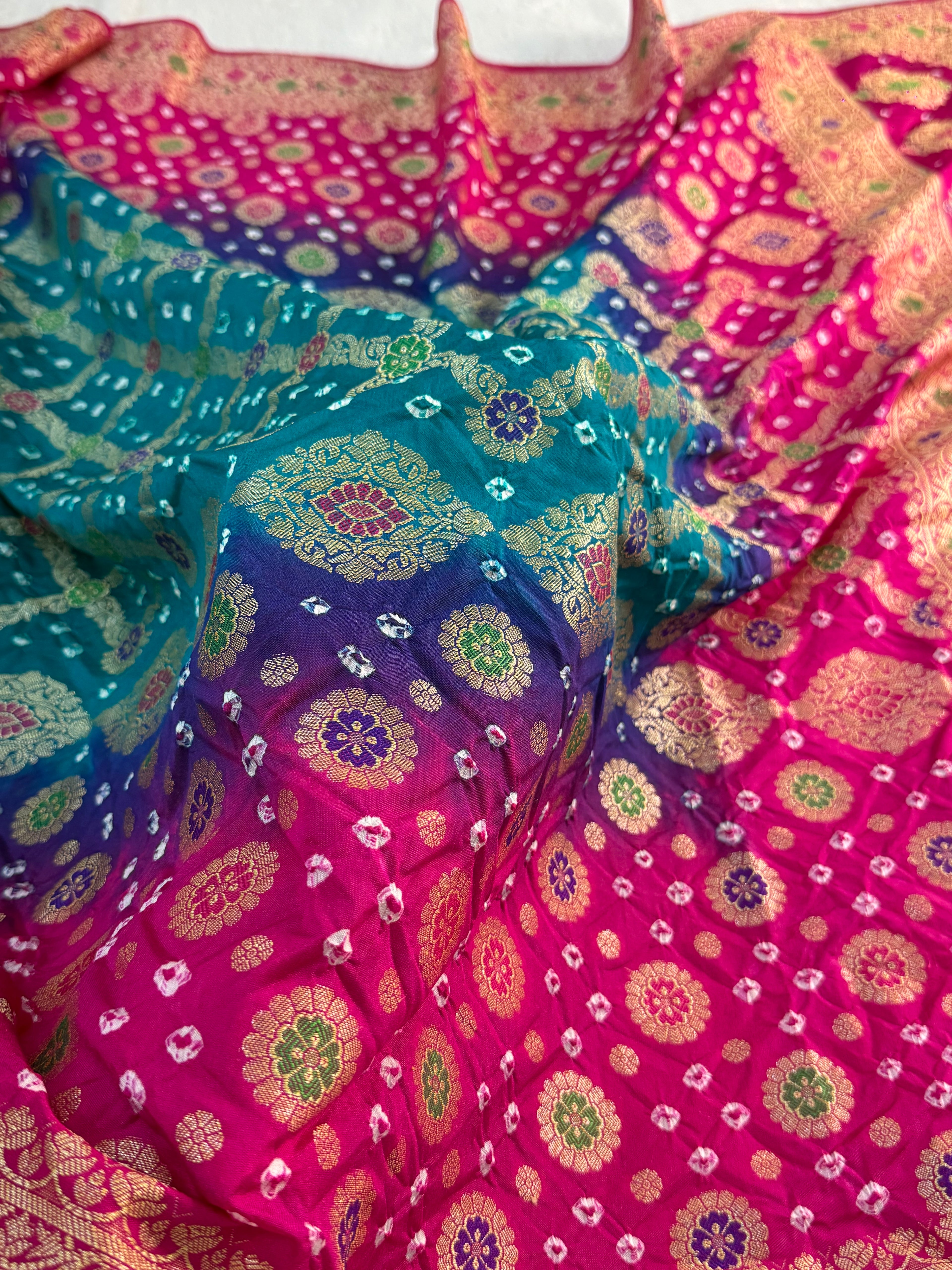 Banarasi Raw Silk Saree with Hand bandej all over in Motifs Design in Rani and Bottle Green Colour