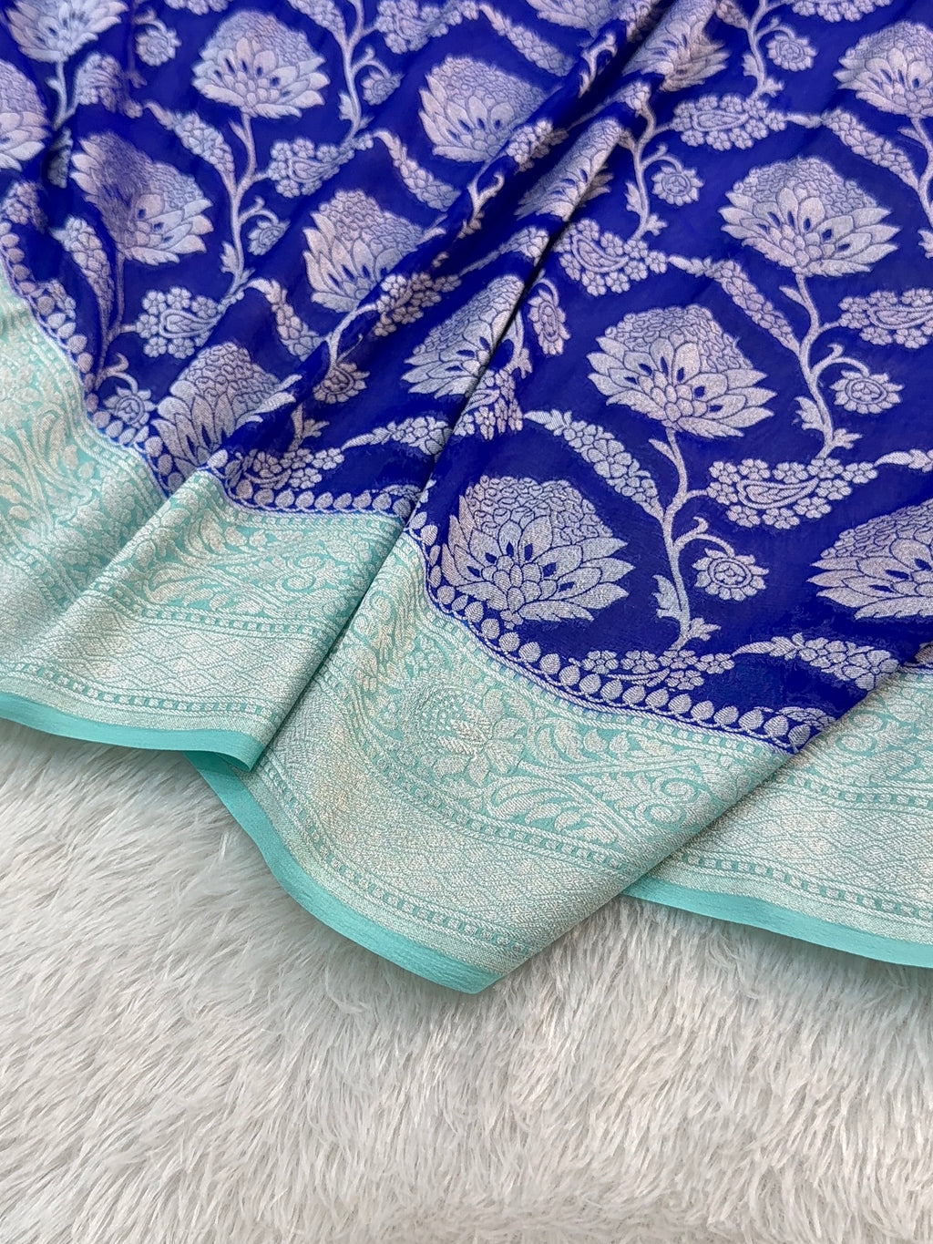 Banarasi Pure Khaddi Chiffon Saree  with Silver Zari Work In Floral Jaal Design in Royal Blue and Light Sea Green Colour Combination