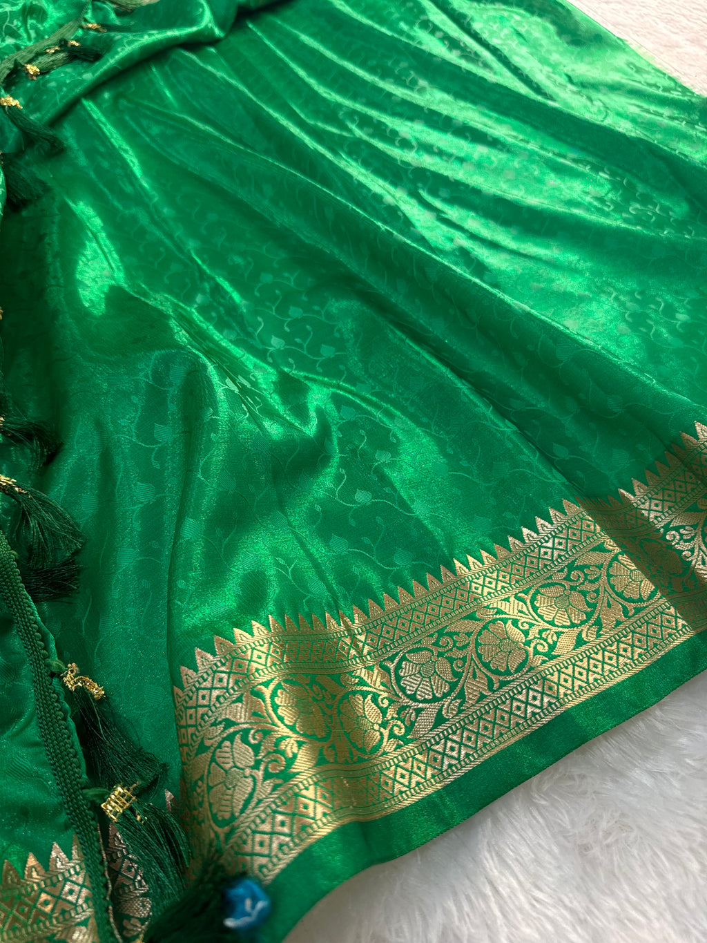 Banarasi satin silk saree in Rani color with tanchoi design all over the body