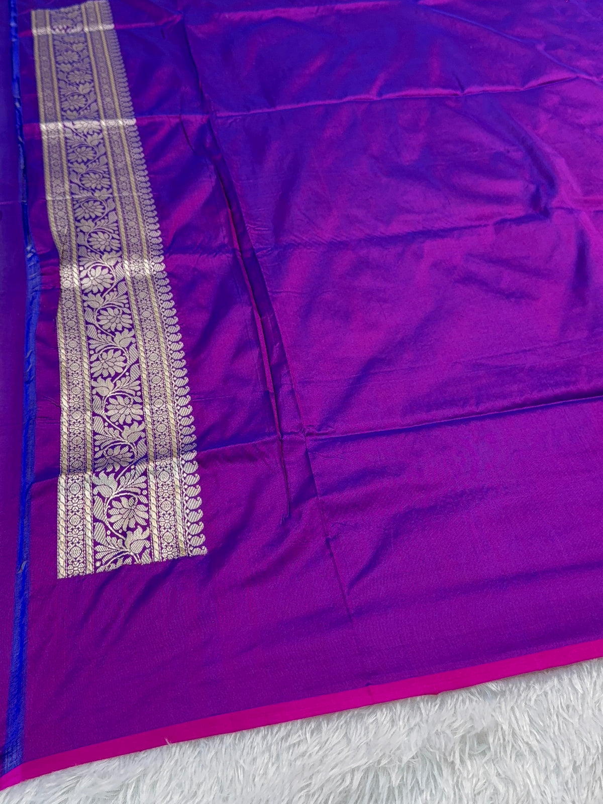 Handwoven pure katan silk saree with interlock weaving motifs in intricate silver and gold zari with Rani Edge in Deep Violet colour