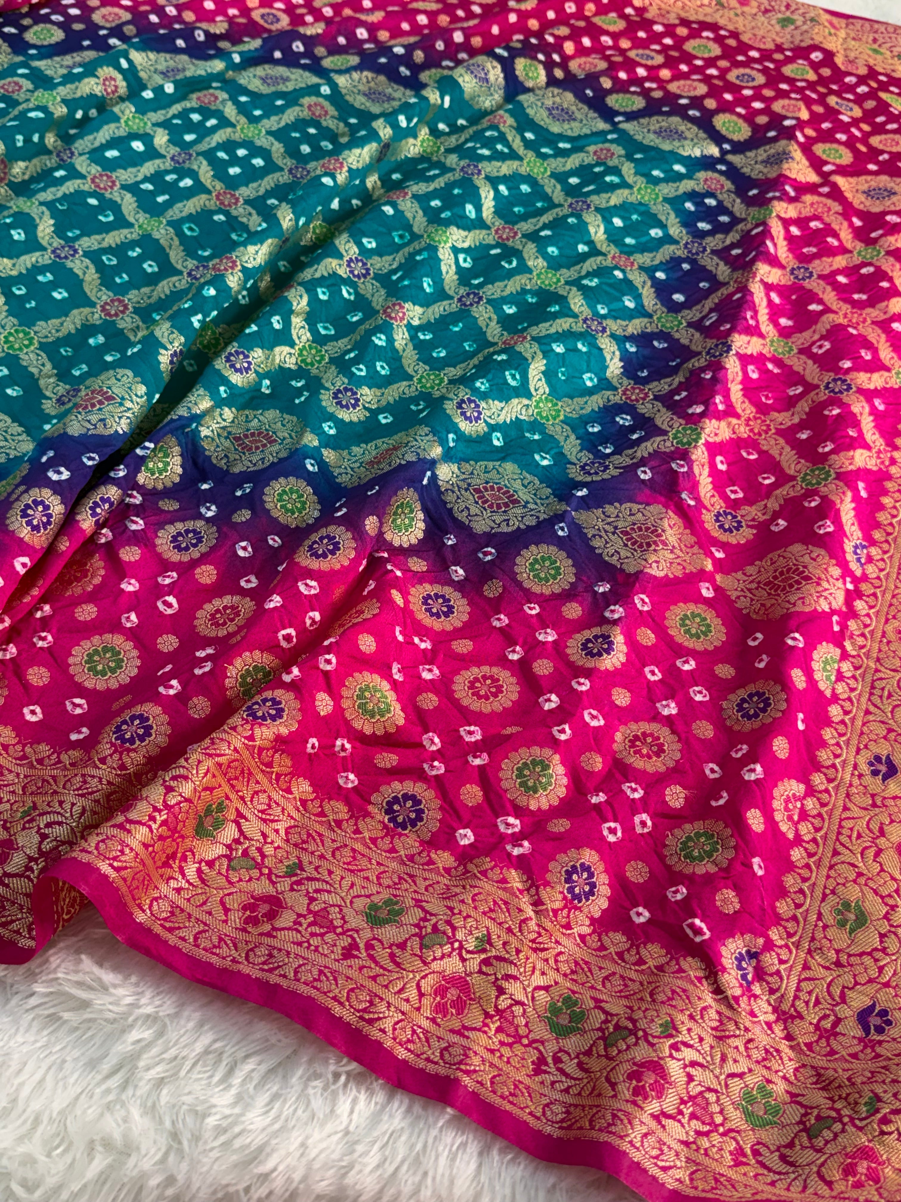 Banarasi Raw Silk Saree with Hand bandej all over in Motifs Design in Rani and Bottle Green Colour