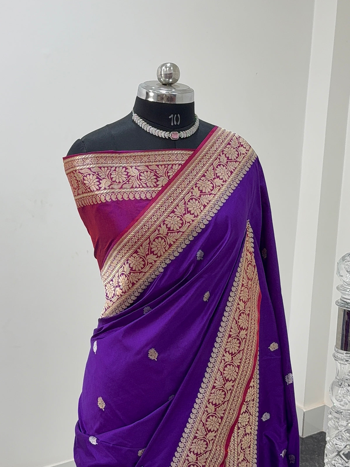 Handwoven pure katan silk saree with interlock weaving motifs in intricate silver and gold zari with Contrast of Deep Violet and Shot Rani Colour