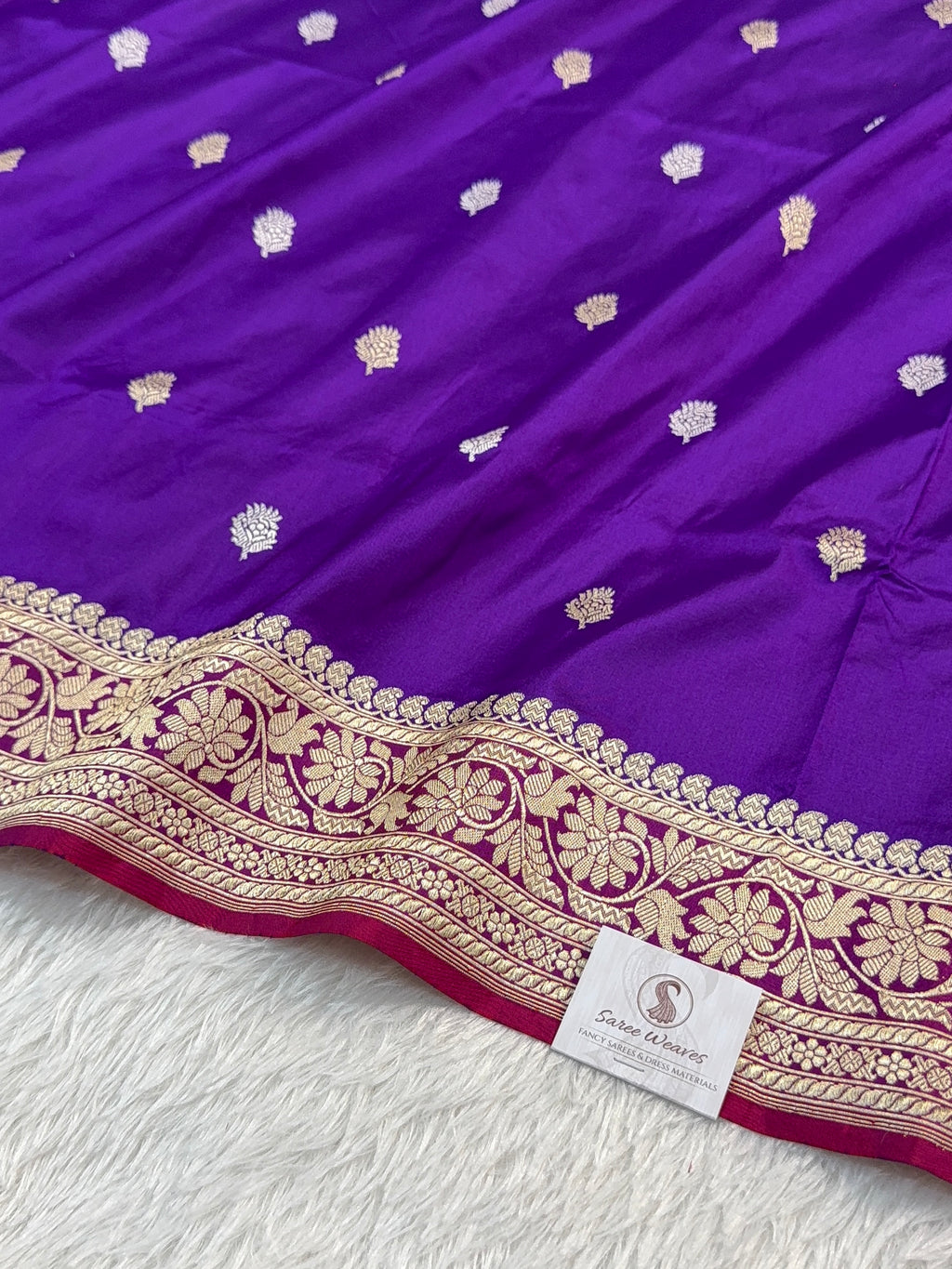 Handwoven pure katan silk saree with interlock weaving motifs in intricate silver and gold zari with Contrast of Deep Violet and Shot Rani Colour