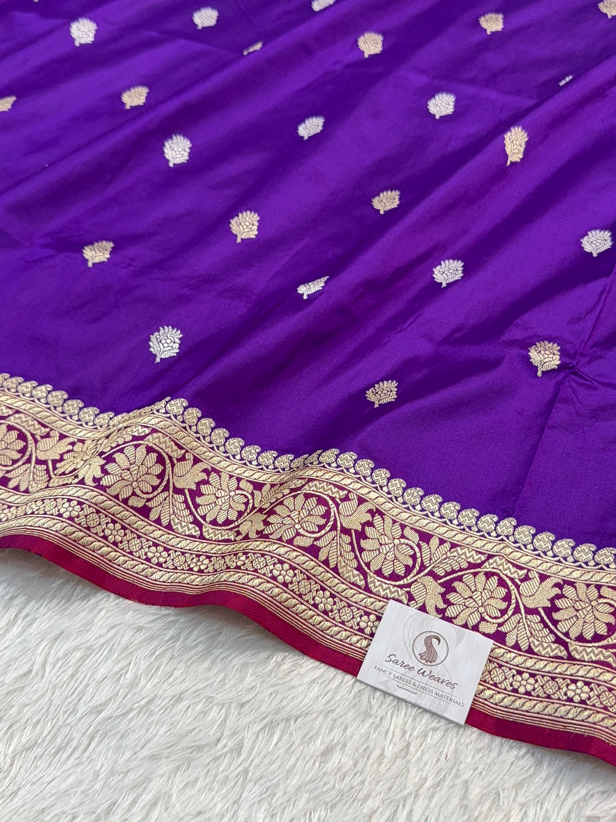 Handwoven pure katan silk saree with interlock weaving motifs in intricate silver and gold zari with Contrast of Deep Violet and Shot Rani Colour