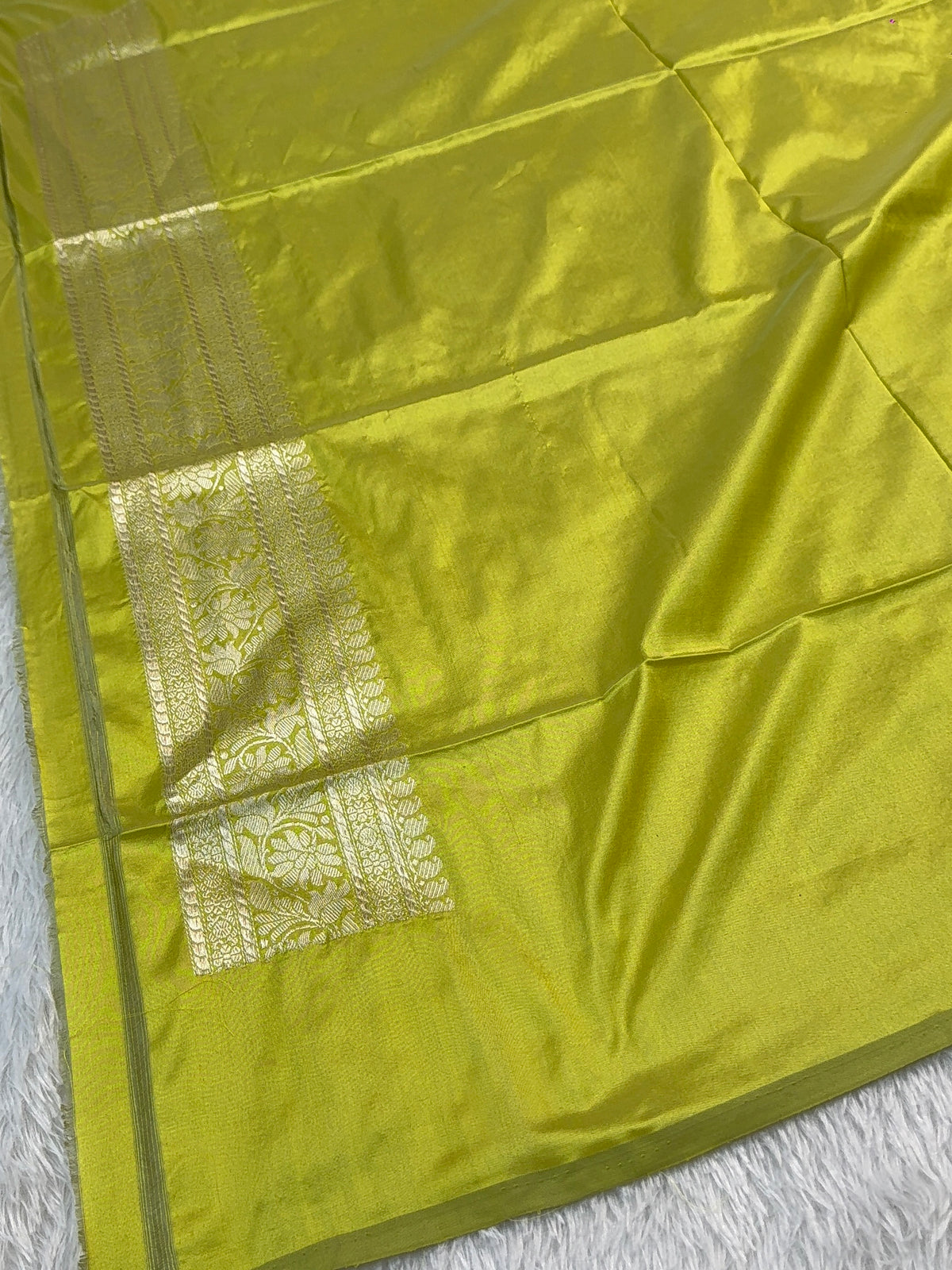 Handwoven pure katan silk saree with interlock weaving motifs with intricate silver zari in Neon Pista colour