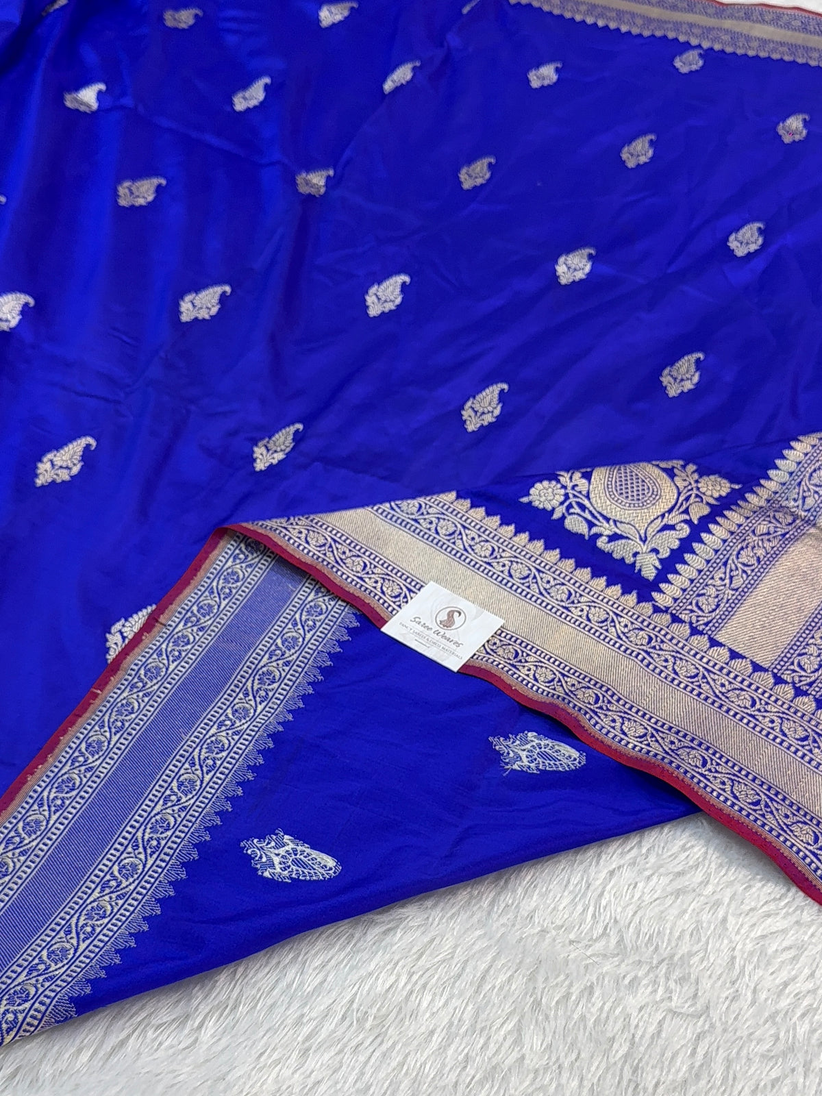 Handwoven pure katan silk saree with interlock weaving motifs in intricate silver and gold zari with Maroon Edge and Konia design in Royal Blue colour