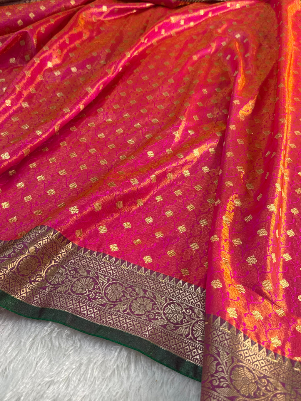 Banarasi satin silk saree in Rani color with tanchoi design all over the body