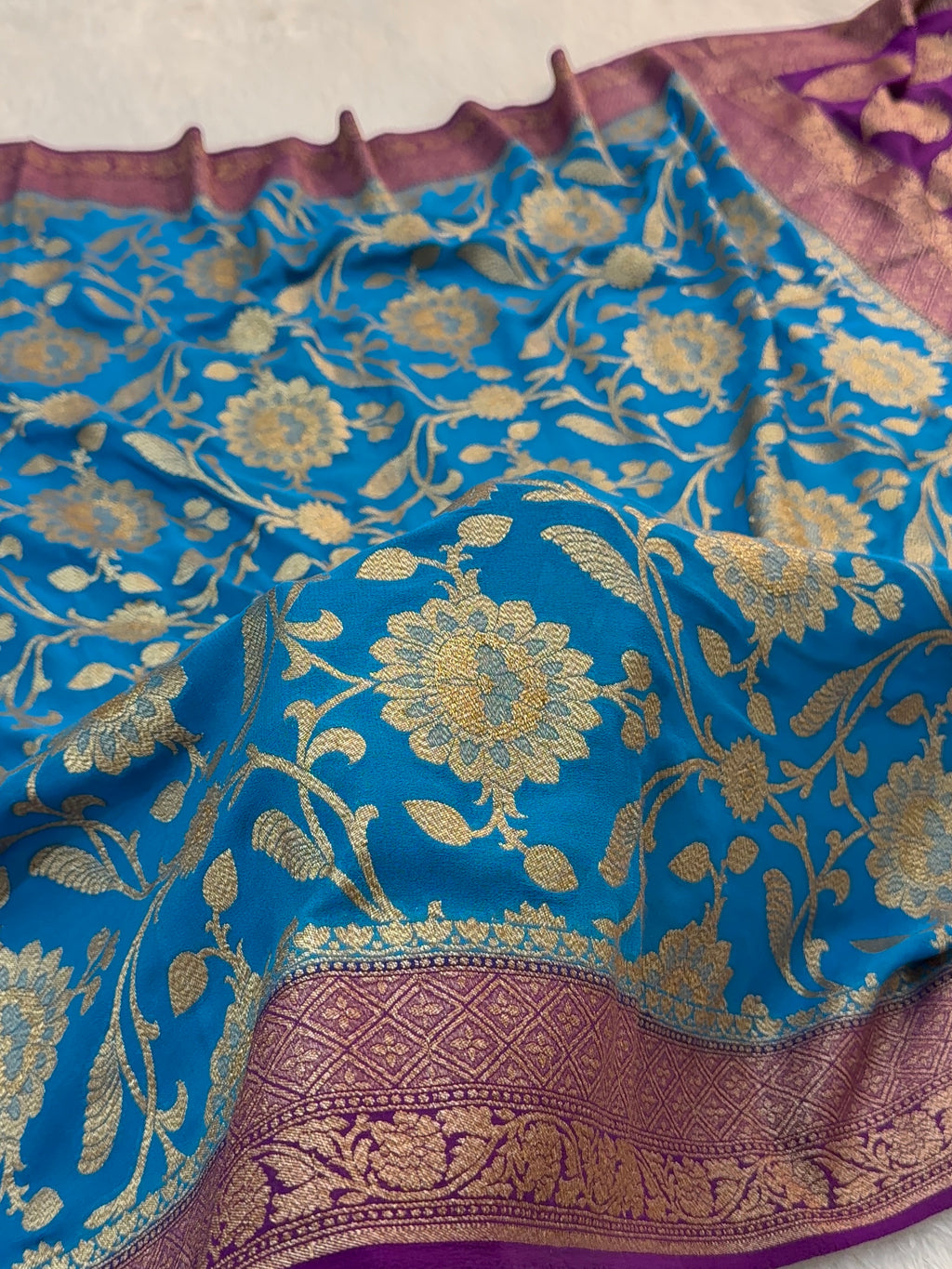 Banarasi Pure Khaddi Chiffon Saree  with Antique Zari Work In Floral Jaal Design in Peacock Blue Colour