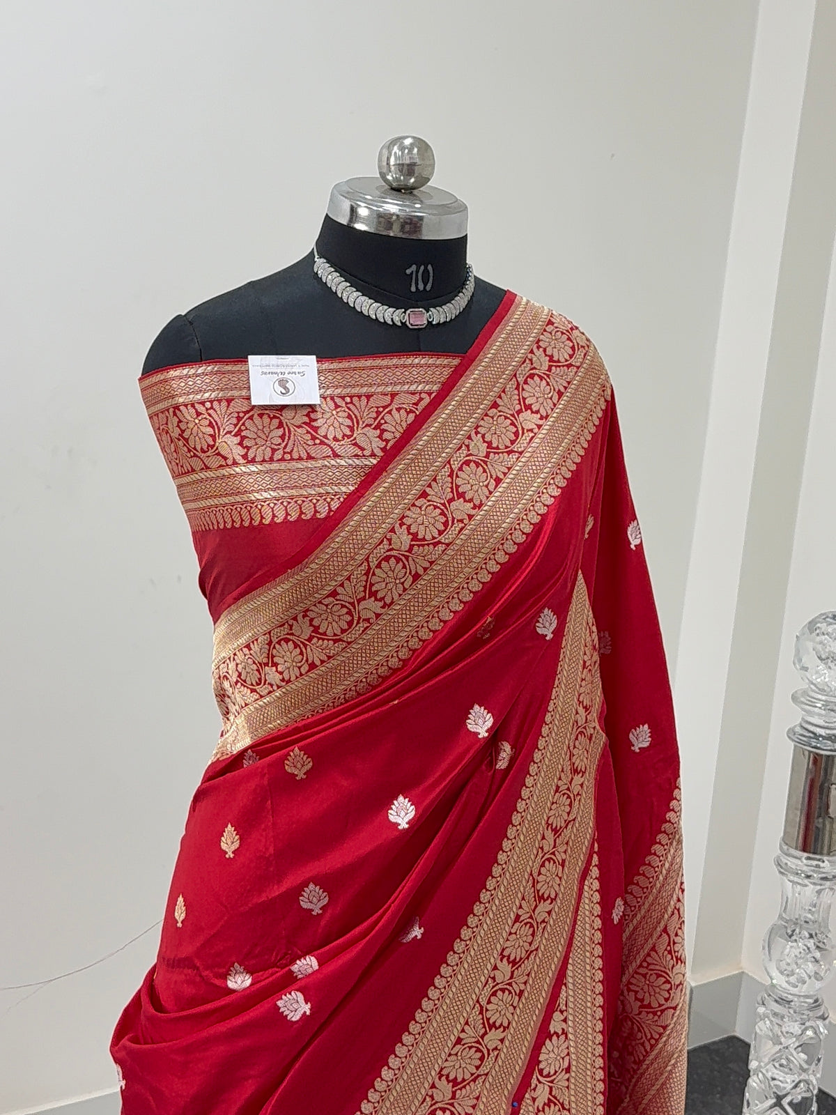 Handwoven pure katan silk saree with interlock weaving motifs with intricate silver and gold zari in red colour