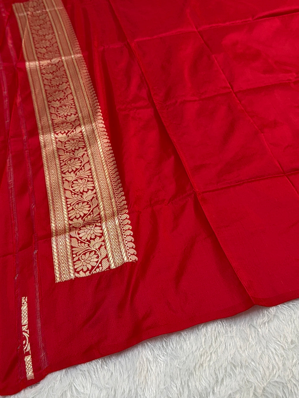 Handwoven pure katan silk saree with interlock weaving motifs with intricate silver and gold zari in red colour