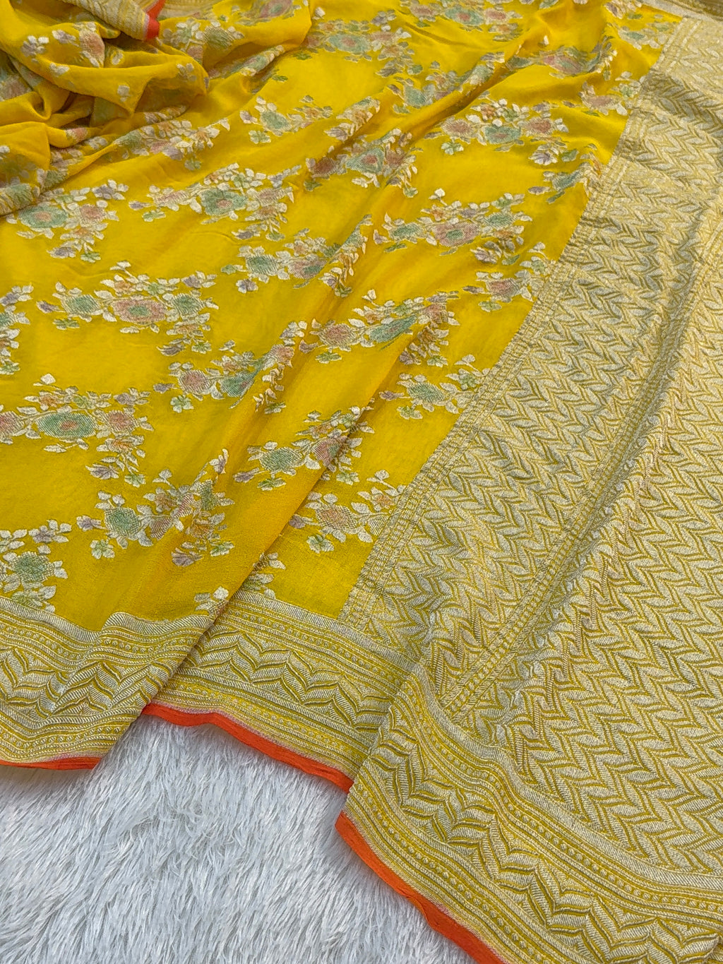 Banarasi Pure Khaddi Chiffon Saree  with Silver Zari Work In Floral Jaal Design with Meenakari by handbrush Yellow Colour with orange edge