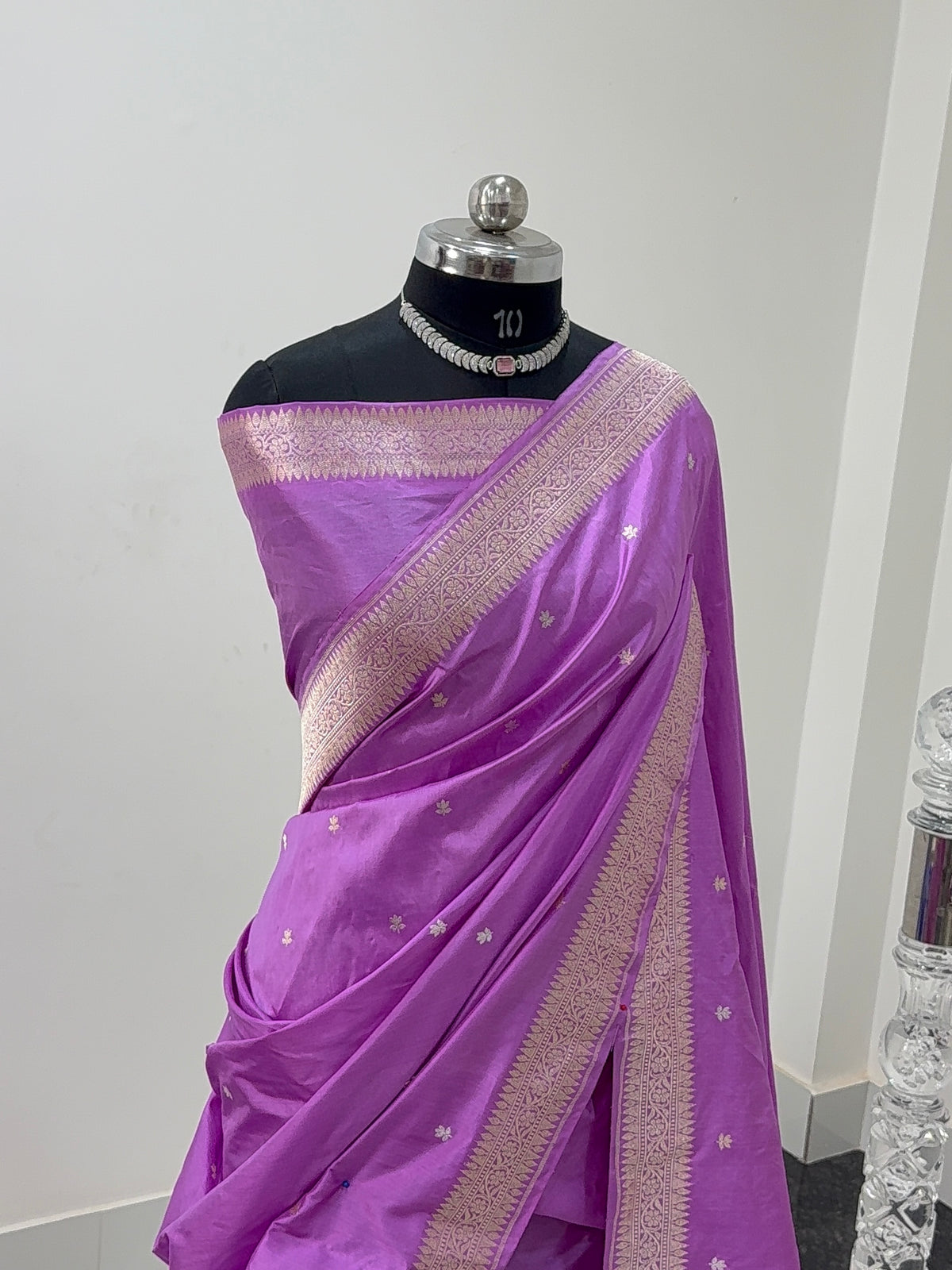 Handwoven pure katan silk saree with interlock weaving motifs and Konia design with intricate silver and gold zari in a light Purple colour