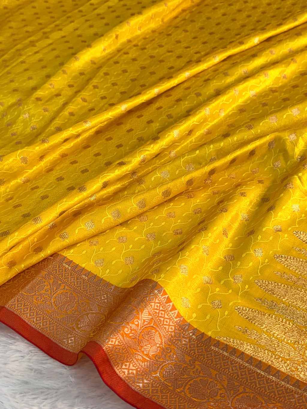 Banarasi satin silk saree in yellow color with tanchoi design all over the body