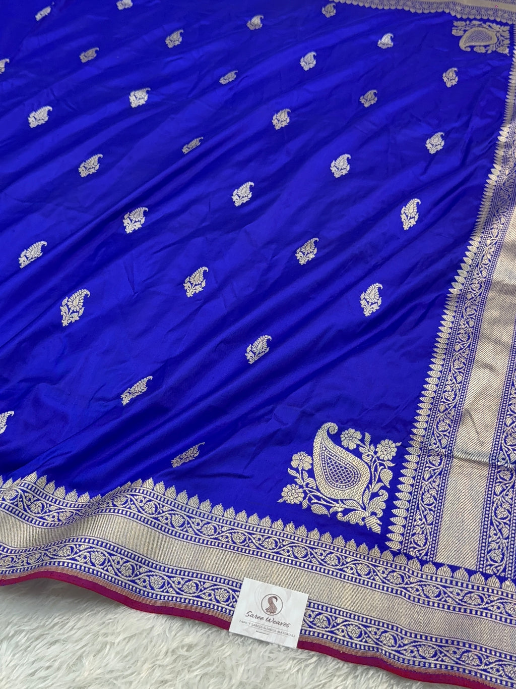 Handwoven pure katan silk saree with interlock weaving motifs in intricate silver and gold zari with Maroon Edge and Konia design in Royal Blue colour