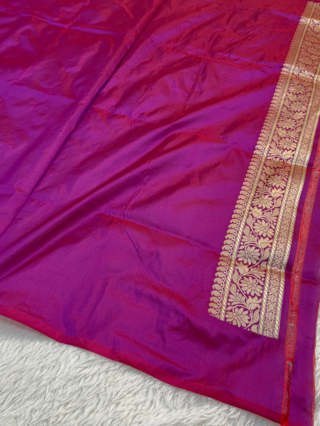 Handwoven pure katan silk saree with interlock weaving motifs in intricate silver and gold zari with Contrast of Deep Violet and Shot Rani Colour
