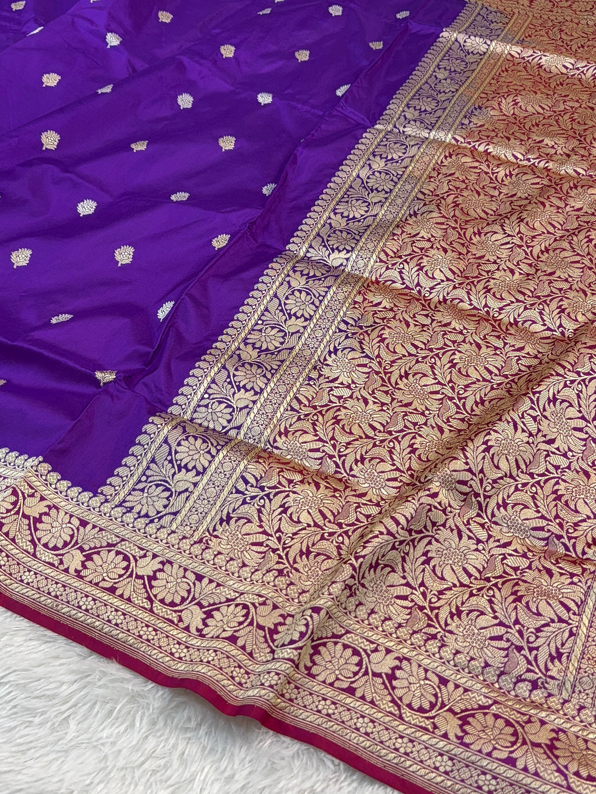Handwoven pure katan silk saree with interlock weaving motifs in intricate silver and gold zari with Contrast of Deep Violet and Shot Rani Colour