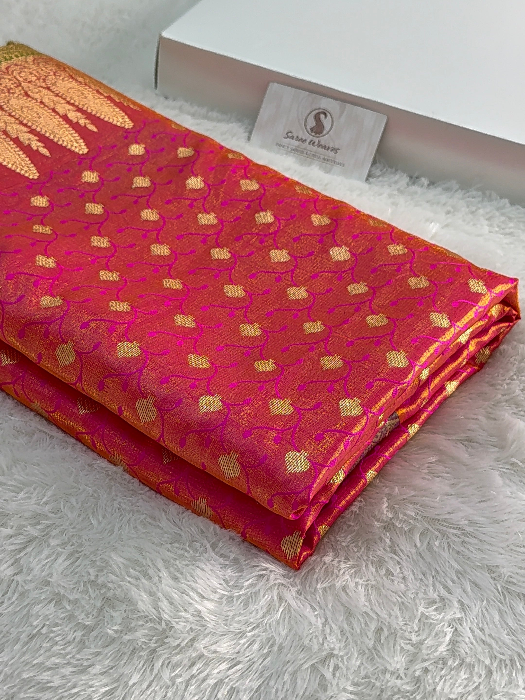 Banarasi satin silk saree in Rani color with tanchoi design all over the body