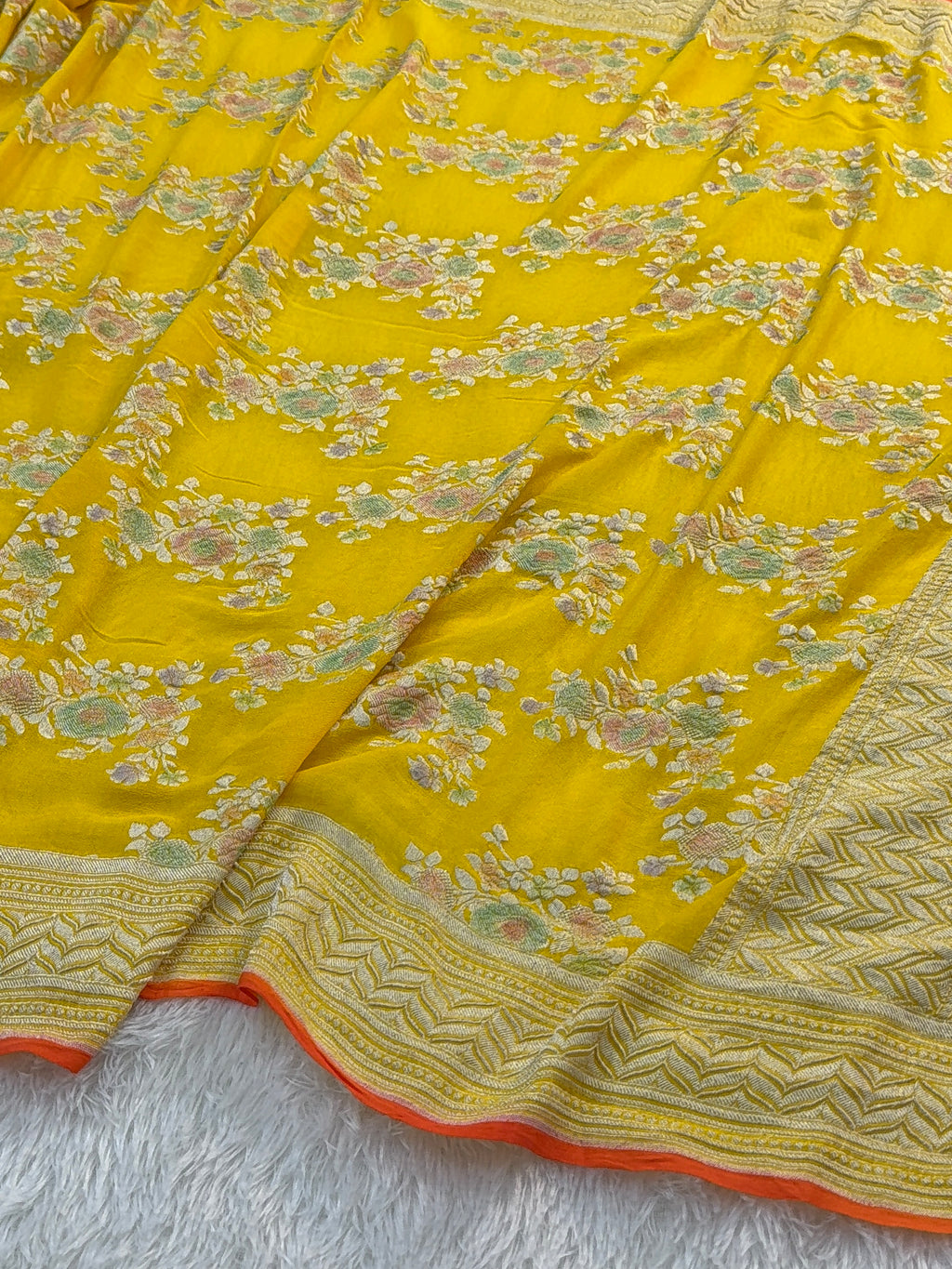 Banarasi Pure Khaddi Chiffon Saree  with Silver Zari Work In Floral Jaal Design with Meenakari by handbrush Yellow Colour with orange edge