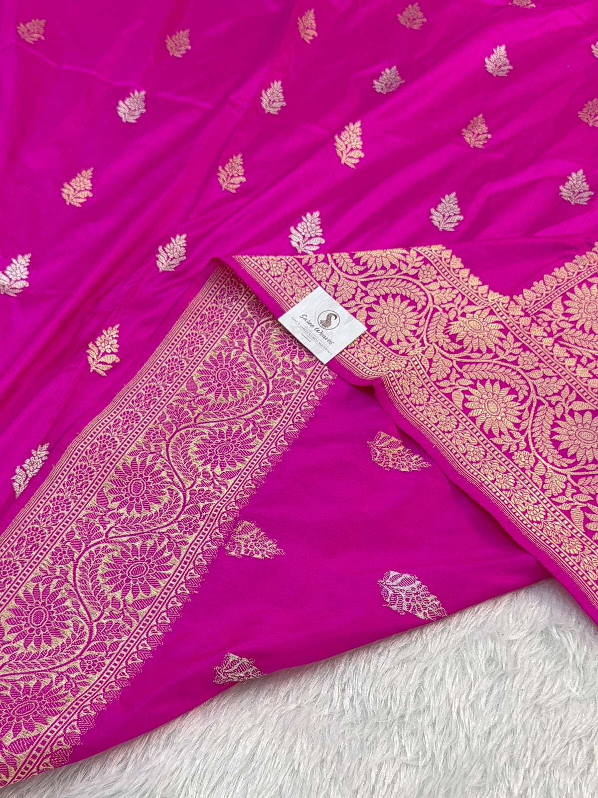 Handwoven pure katan silk saree with interlock weaving motifs with intricate silver and gold zari in a Rani Pink colour