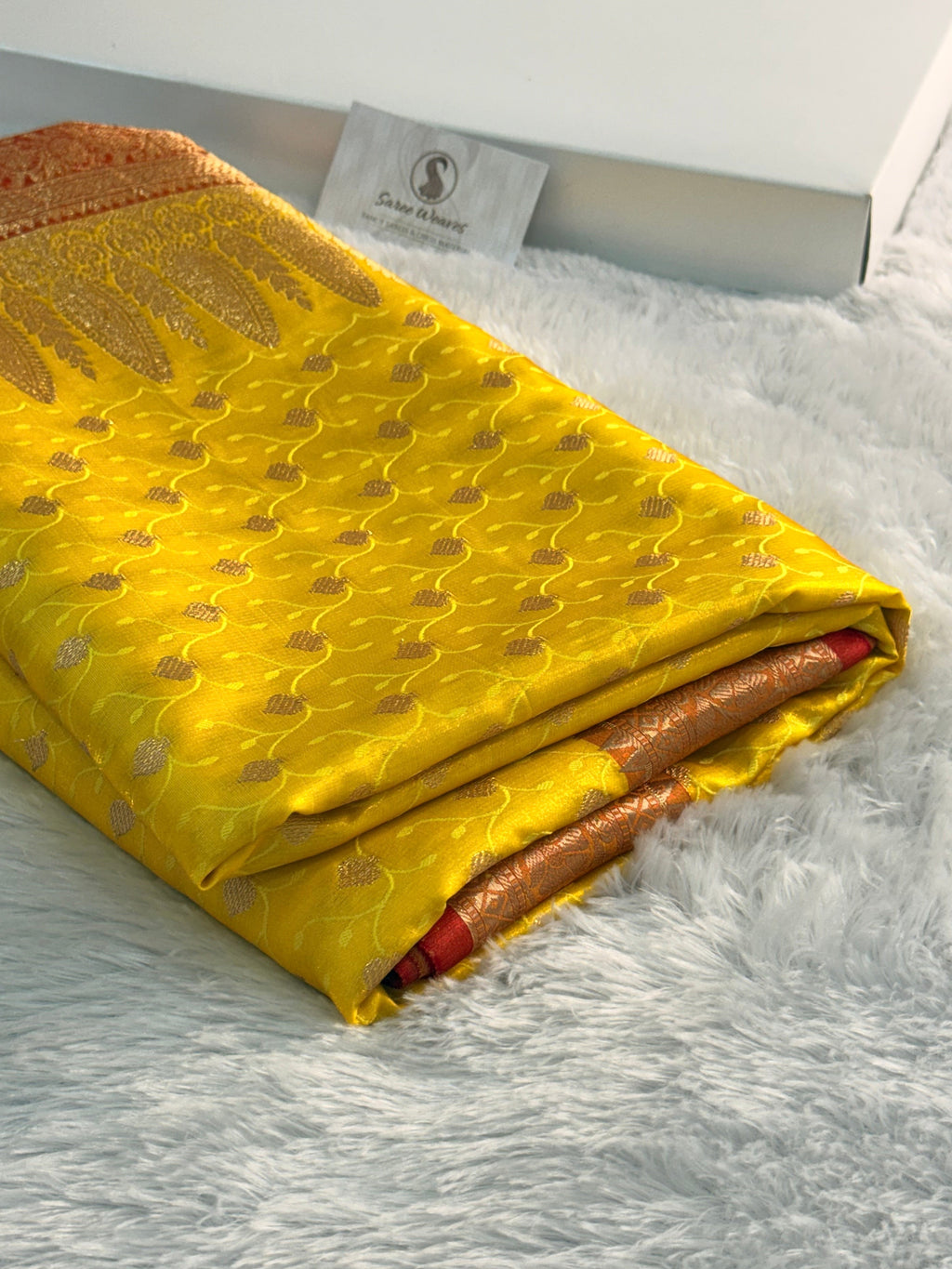 Banarasi satin silk saree in yellow color with tanchoi design all over the body
