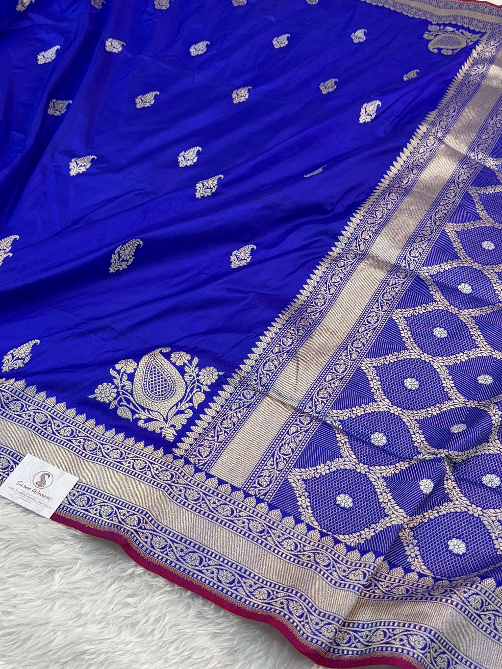 Handwoven pure katan silk saree with interlock weaving motifs in intricate silver and gold zari with Maroon Edge and Konia design in Royal Blue colour