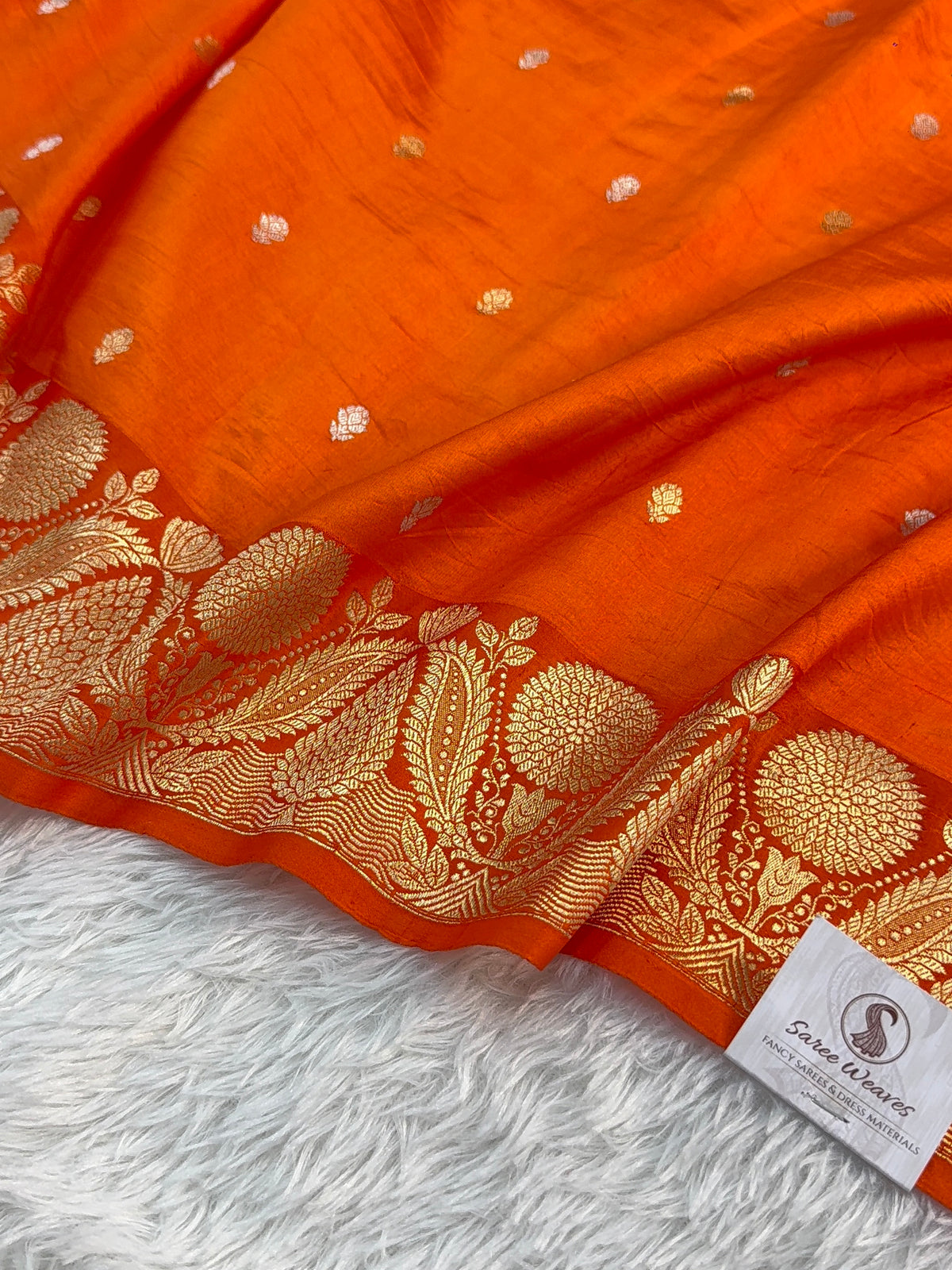 Banarasi Raw Mango Silk Saree in Border and Buti Design in Silver and Gold Zari work in a orange Color