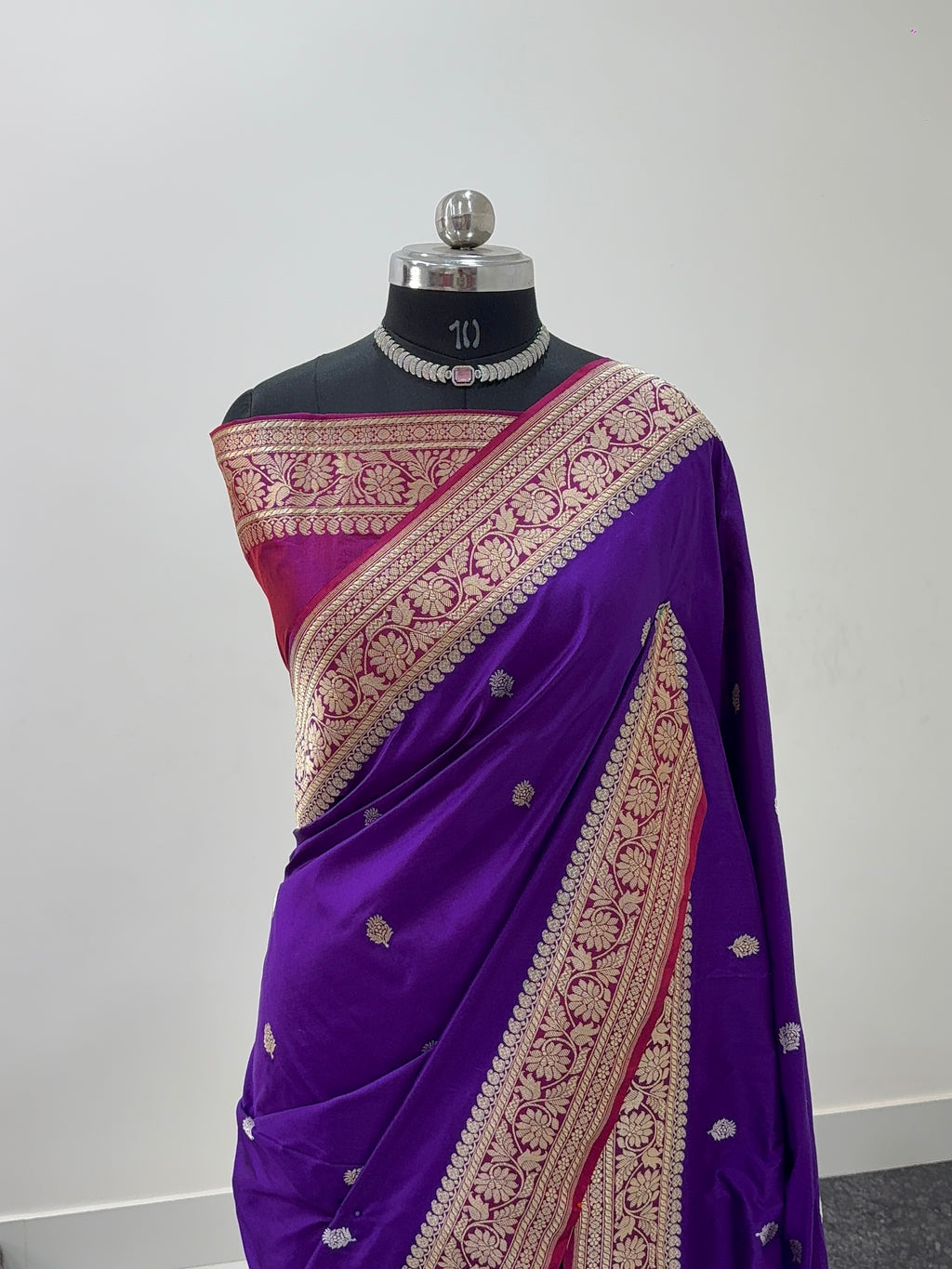 Handwoven pure katan silk saree with interlock weaving motifs in intricate silver and gold zari with Contrast of Deep Violet and Shot Rani Colour