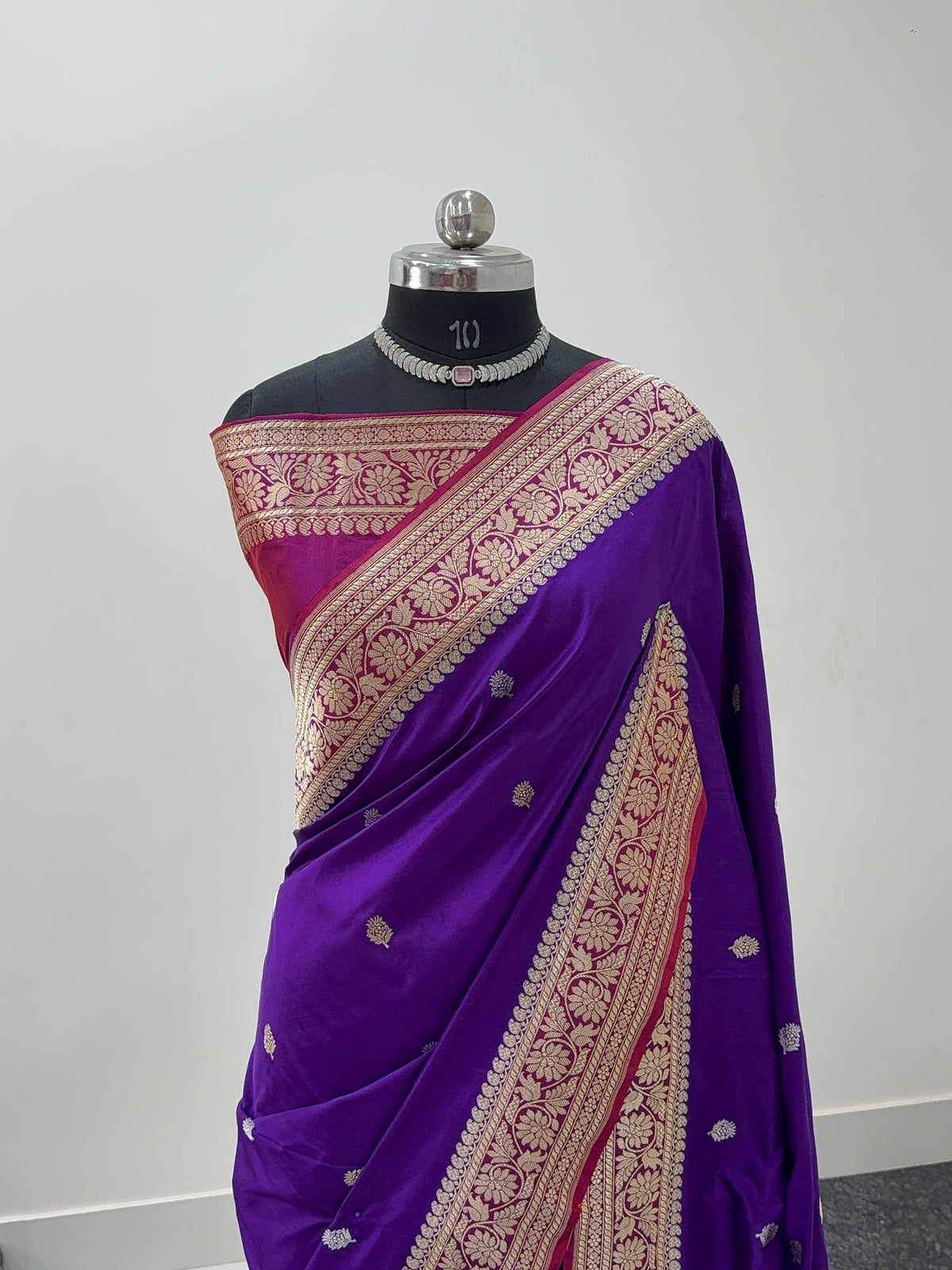 Handwoven pure katan silk saree with interlock weaving motifs in intricate silver and gold zari with Contrast of Deep Violet and Shot Rani Colour