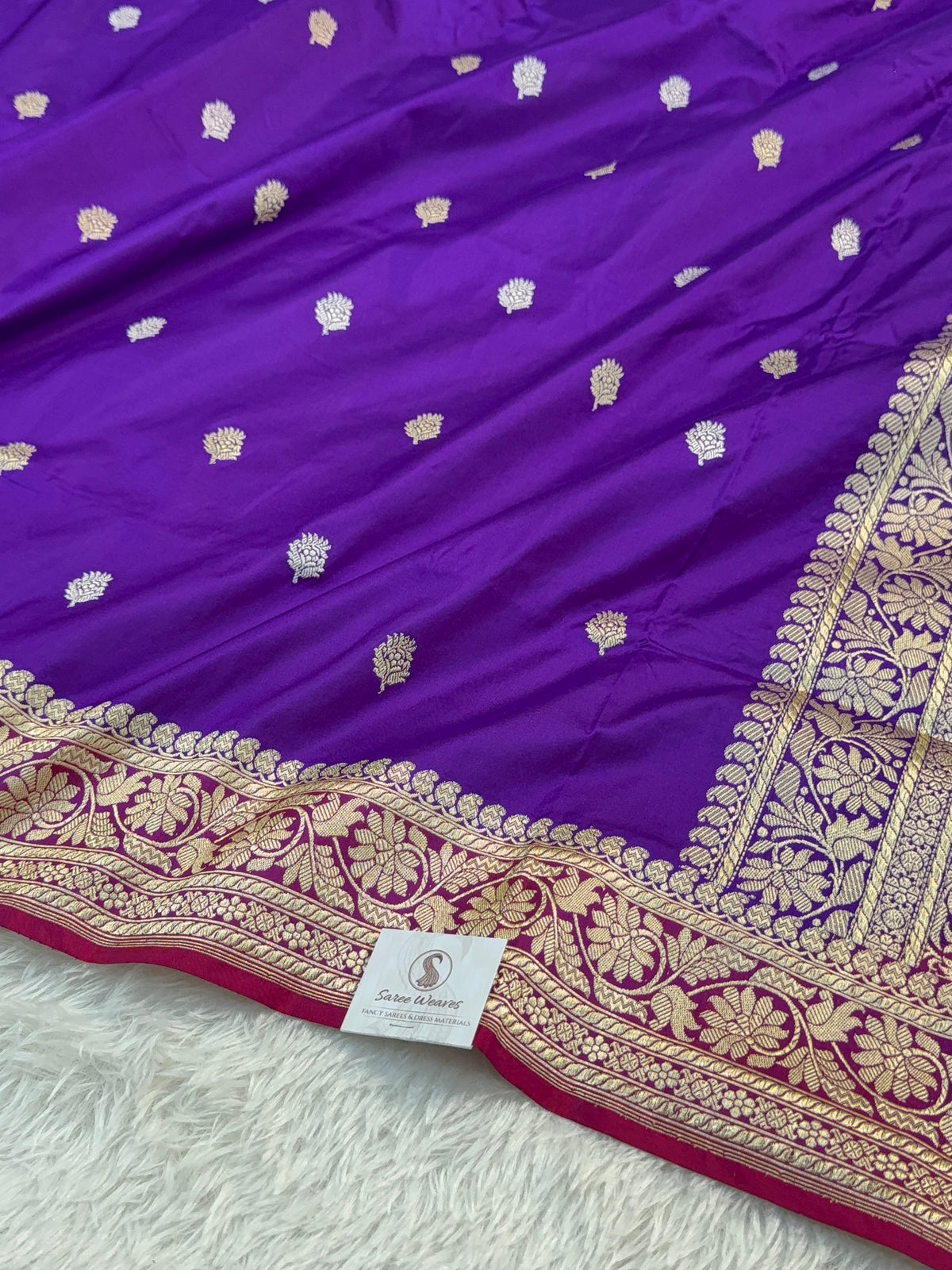 Handwoven pure katan silk saree with interlock weaving motifs in intricate silver and gold zari with Contrast of Deep Violet and Shot Rani Colour