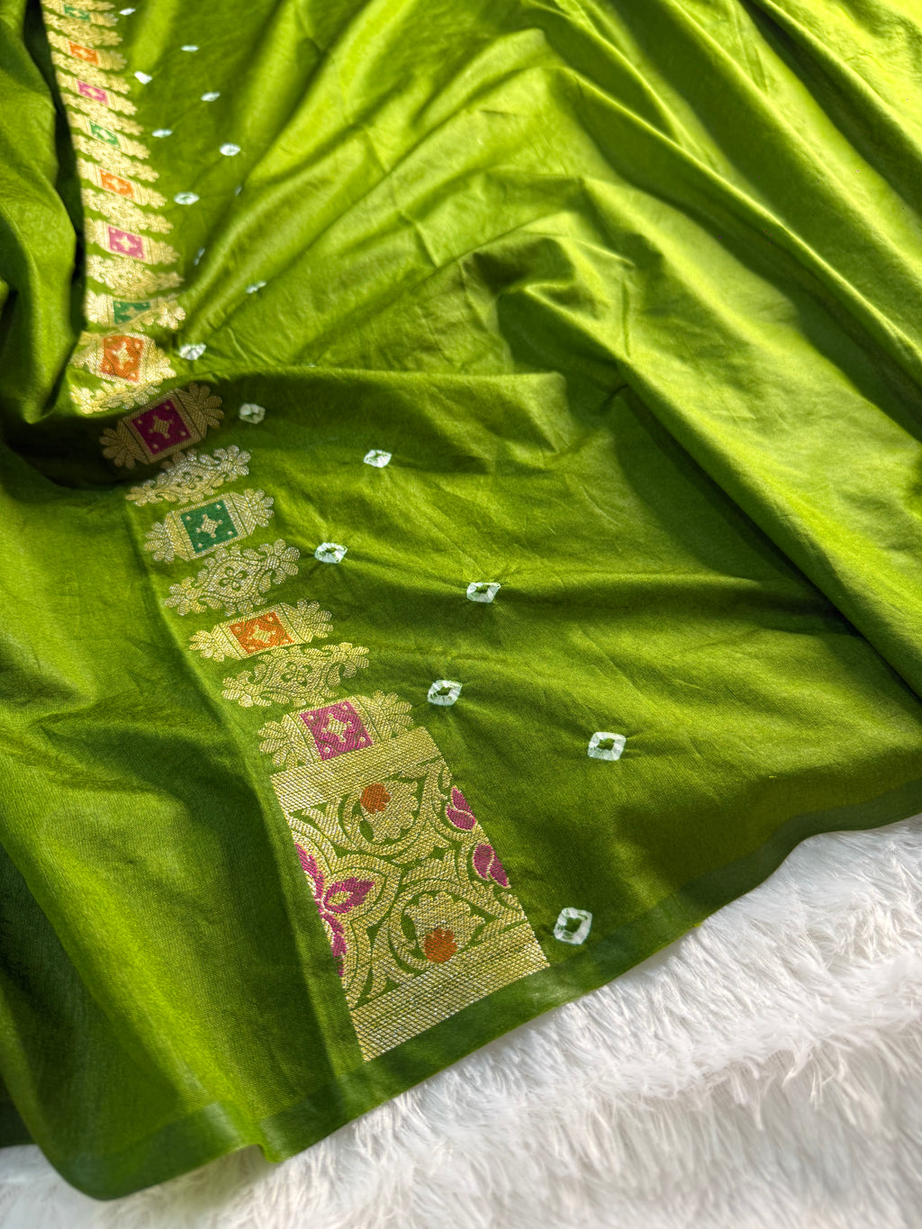 Banarasi Raw Silk Saree with Hand bandej all over in Jaal Design in Parrot Green Colour